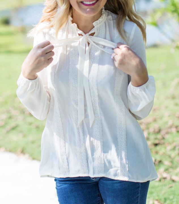 tie neck top, jeans and booties