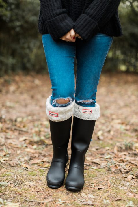 rain boots and turtleneck sweater 