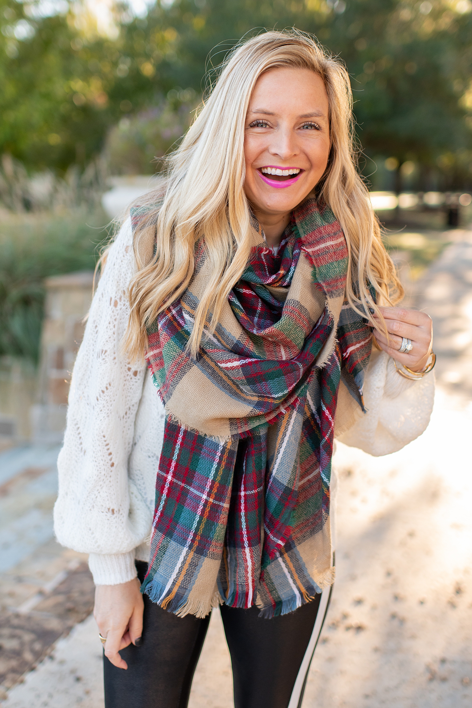 Winter fashion Amazon Favorites featured by top Houston fashion blogger, Fancy Ashley: image of a woman wearing a balloon sleeve sweater, plaid shawl scarf, gold and leopard sneakers, shoulder tote bag and SPANX faux leather leggings