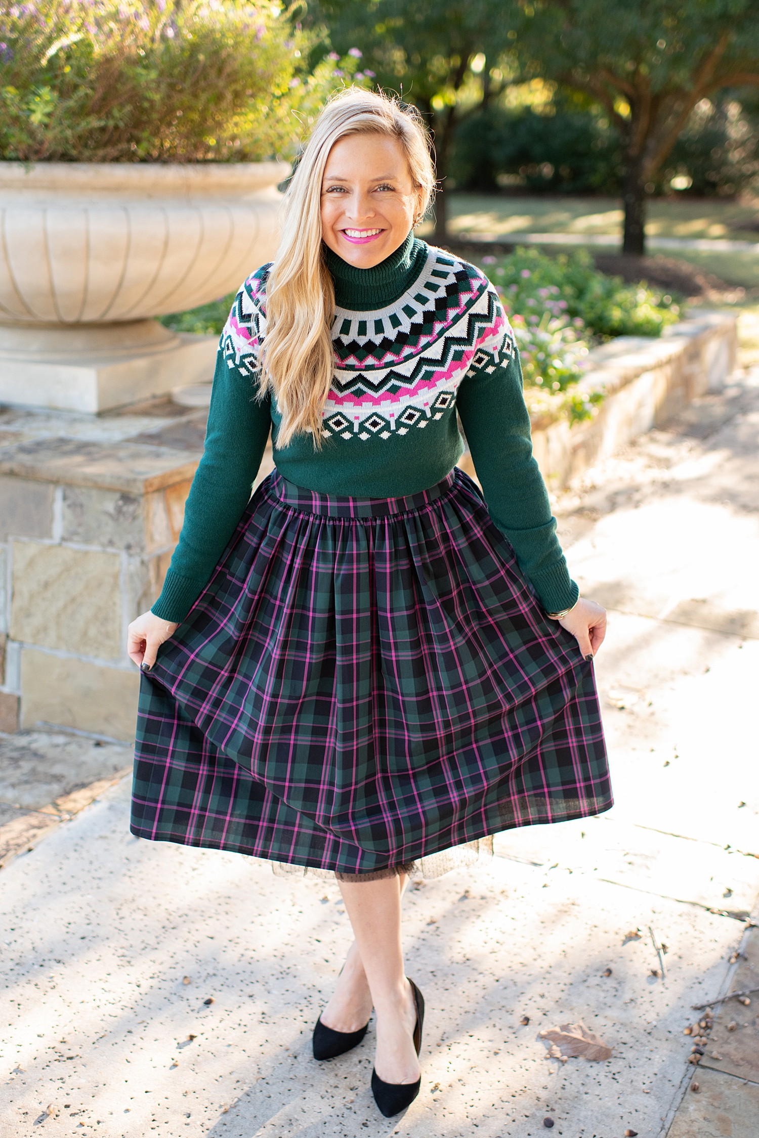 Top Houston fashion blogger, Fancy Ashley, features 7 Holiday Outfits perfect for the season: image of a woman wearing a Plaid skirt, green turtleneck sweater and Sam Edelman heels, all available at Nordstrom