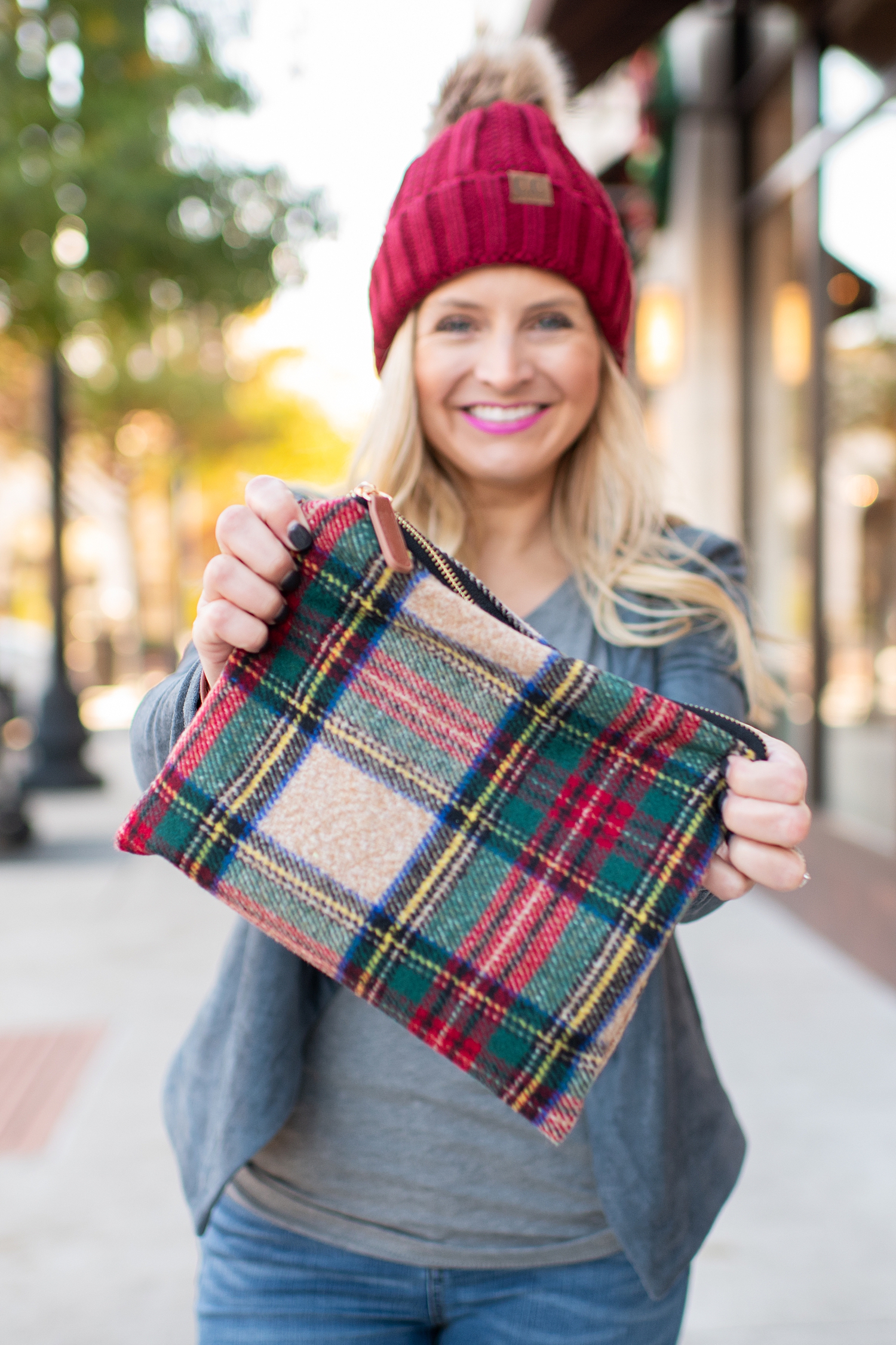Fancy Ashley x Social Threads collection featured by top Houston fashion blogger, Fancy Ashley: image of a Social Threads plaid clutch