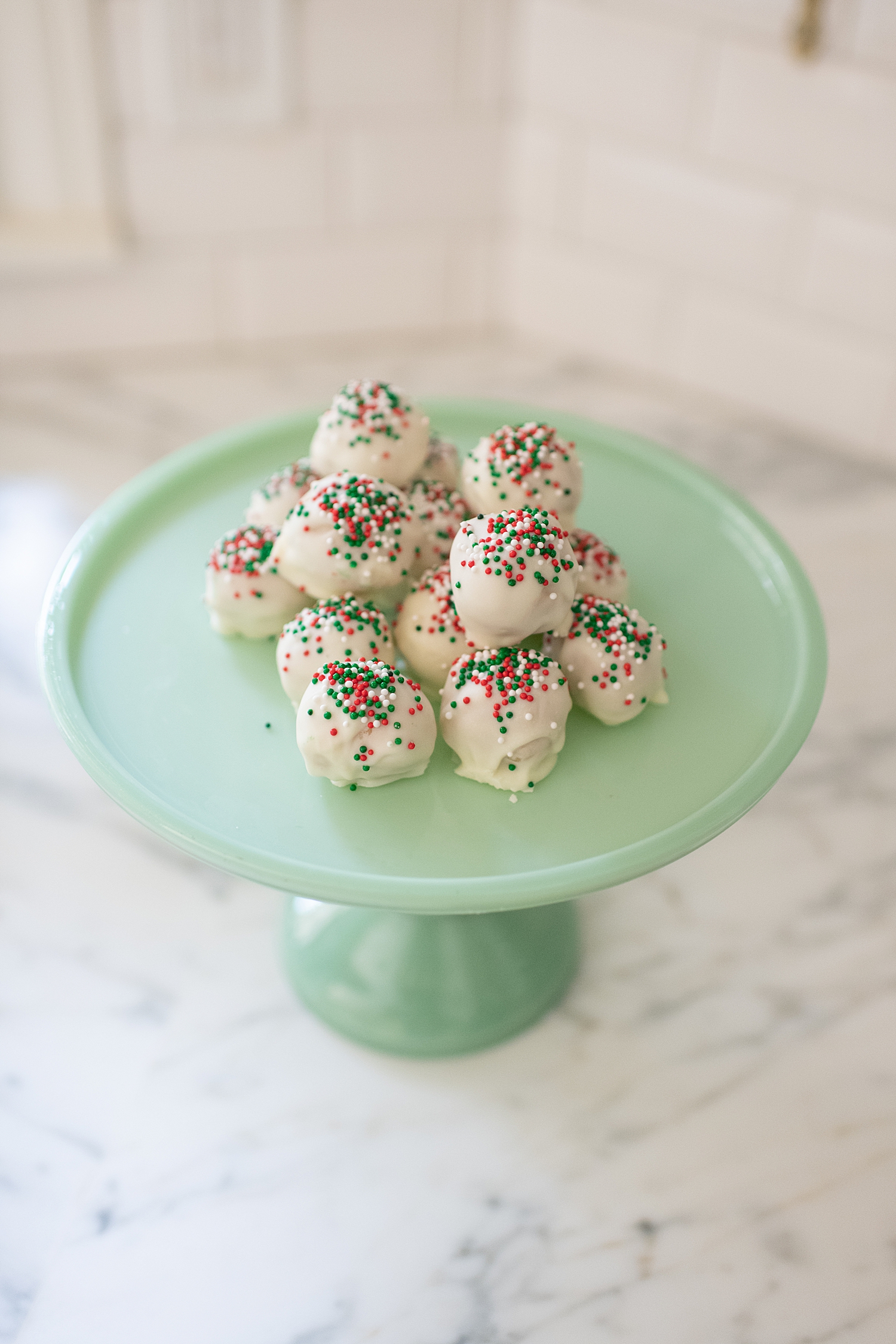 Gluten Free Sugar Cookie Truffles featured by top Houston lifestyle blog, Fancy Ashley: plate of gluten free sugar cookie truffles