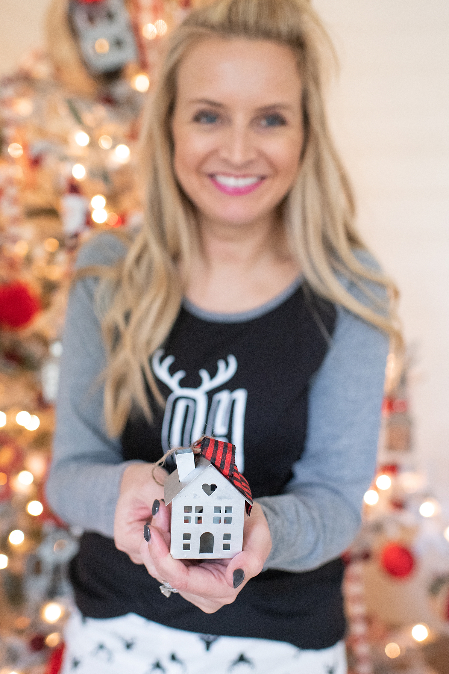 Holiday Pjs & Top Macy's Christmas Gifts featured by top Houston life and style blog, Fancy Ashley" image of a woman wearing Holiday pjs and grey slippers available at Macy's