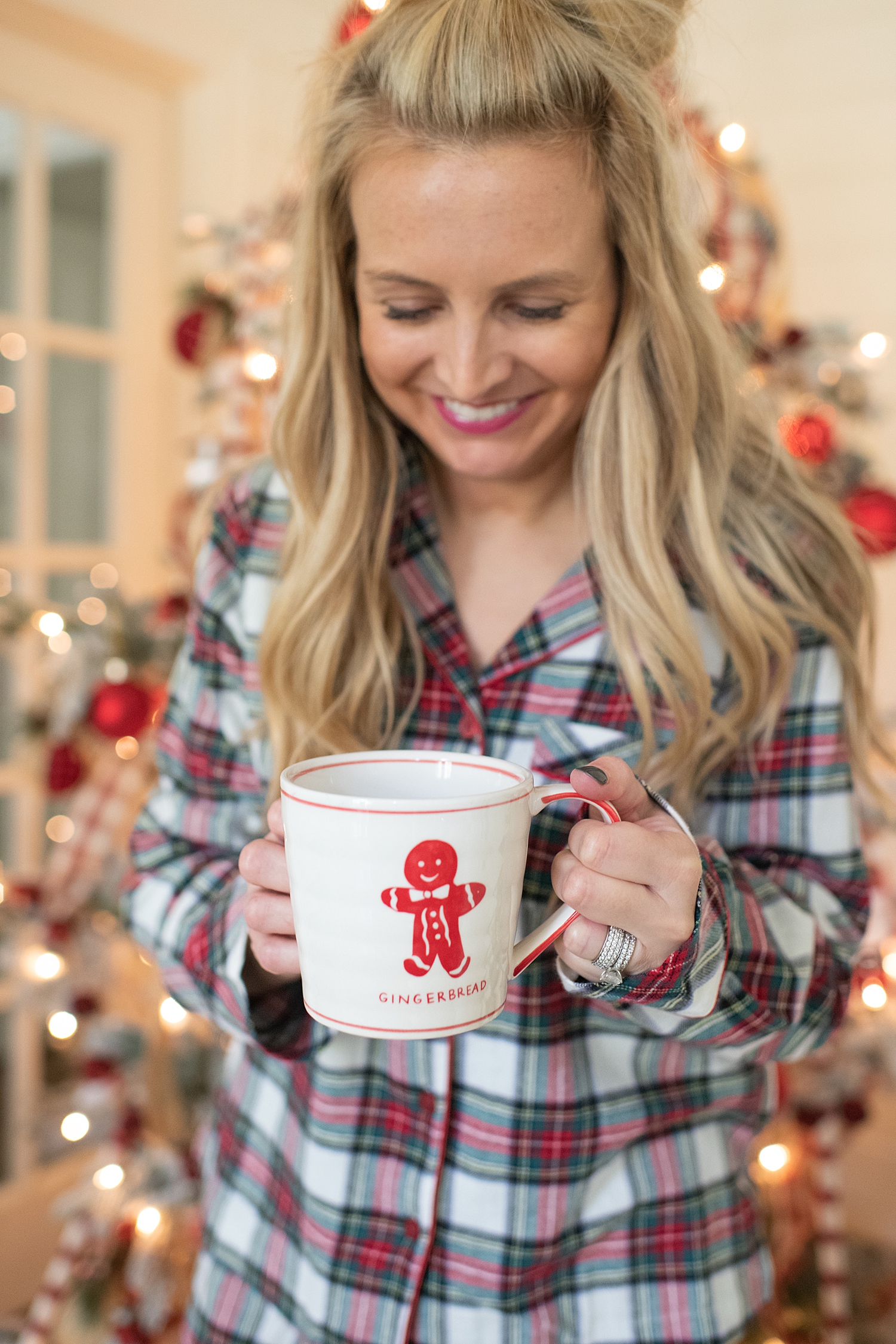 Holiday Pjs & Top Macy's Christmas Gifts featured by top Houston life and style blog, Fancy Ashley" image of a woman wearing plaid Holiday pjs and grey slippers available at Macy's