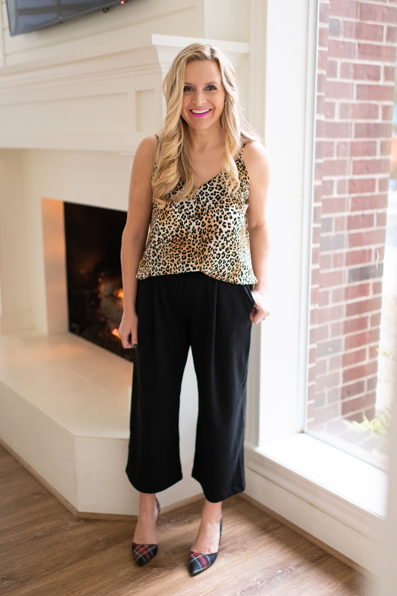 Fancy Ashley x Social Threads collection featured by top Houston fashion blogger, Fancy Ashley: image of a woman wearing a Social Threads Leopard camisole and Social Threads cropped wide legged pants