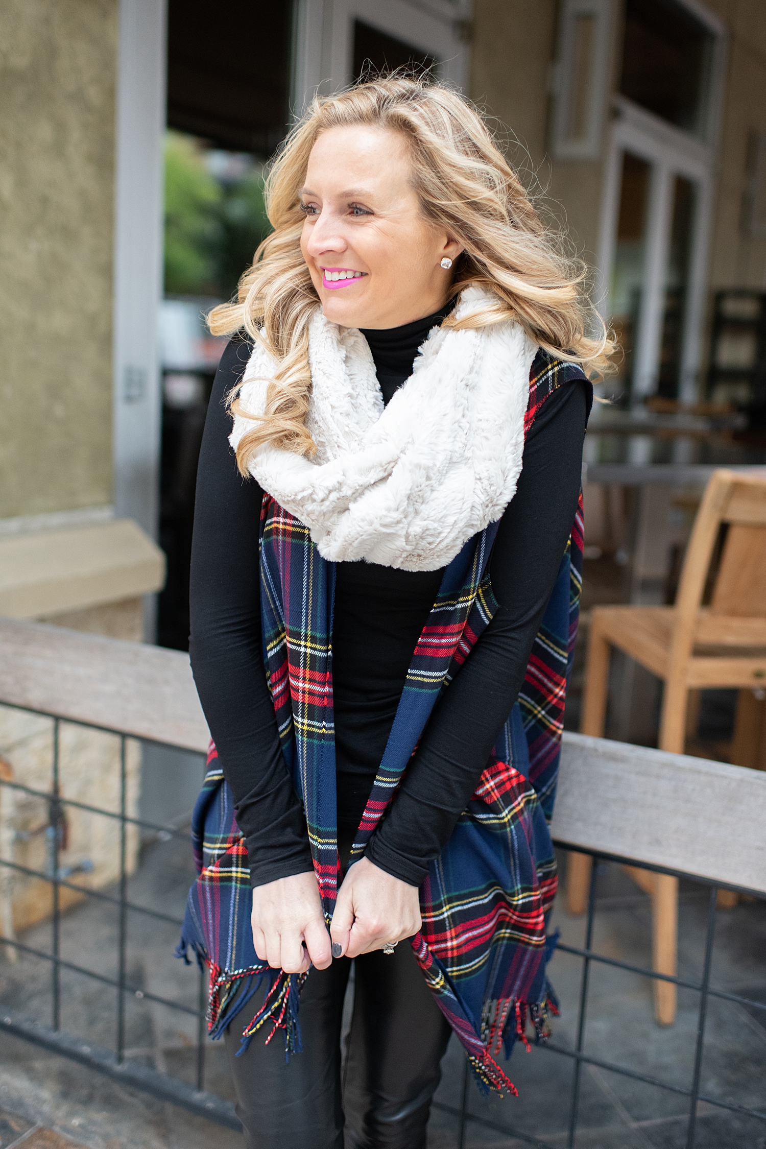 Fancy Ashley x Social Threads collection featured by top Houston fashion blogger, Fancy Ashley: image of a woman wearing a Social Threads plaid vest, Social Threads faux leather leggings, black turtleneck, Social Threads quilted clutch, Social Threads white infinity scarf and Sole Society booties