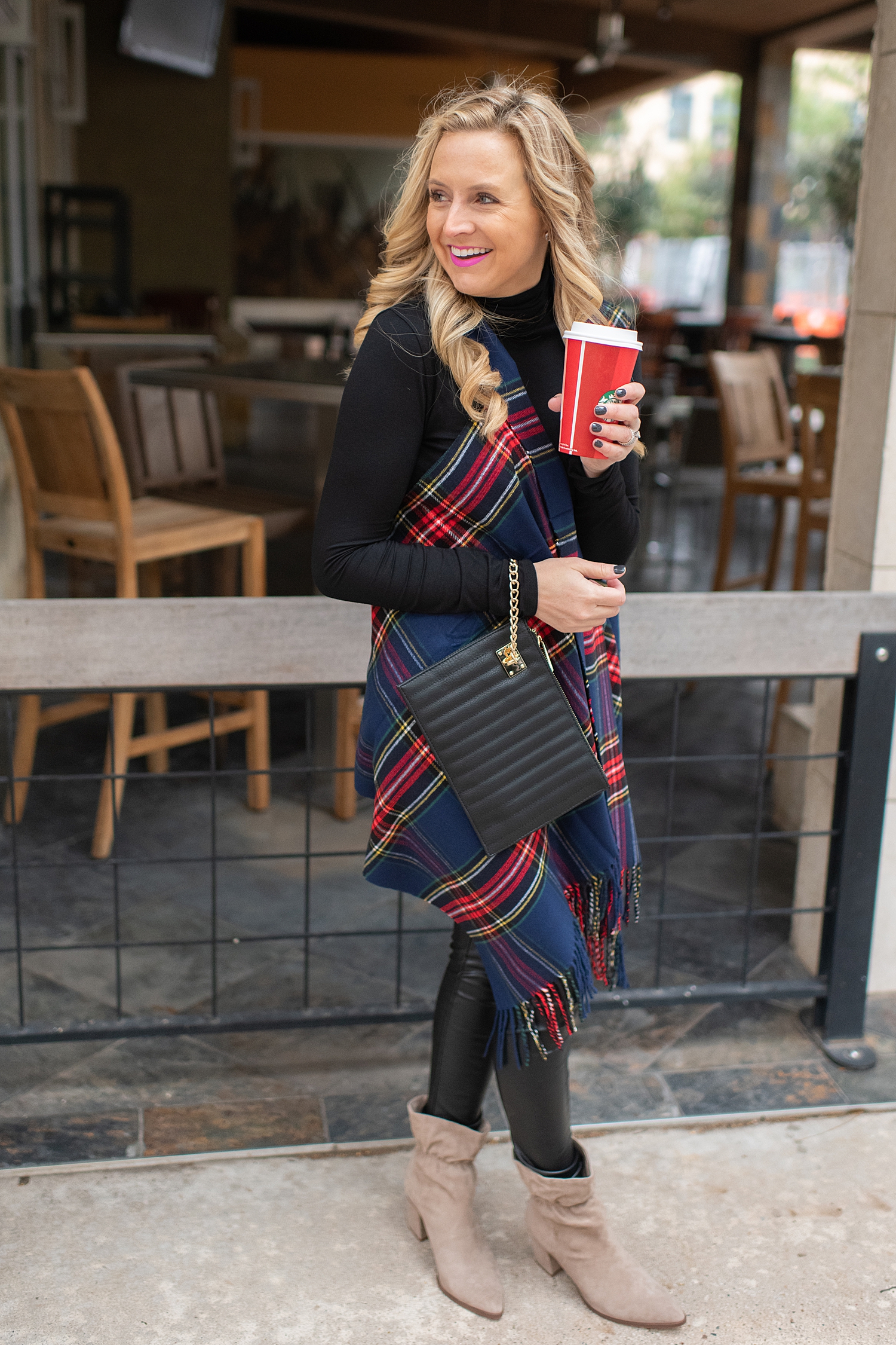 Fancy Ashley x Social Threads collection featured by top Houston fashion blogger, Fancy Ashley: image of a woman wearing a Social Threads plaid vest, Social Threads faux leather leggings, black turtleneck, Social Threads quilted clutch and Sole Society booties