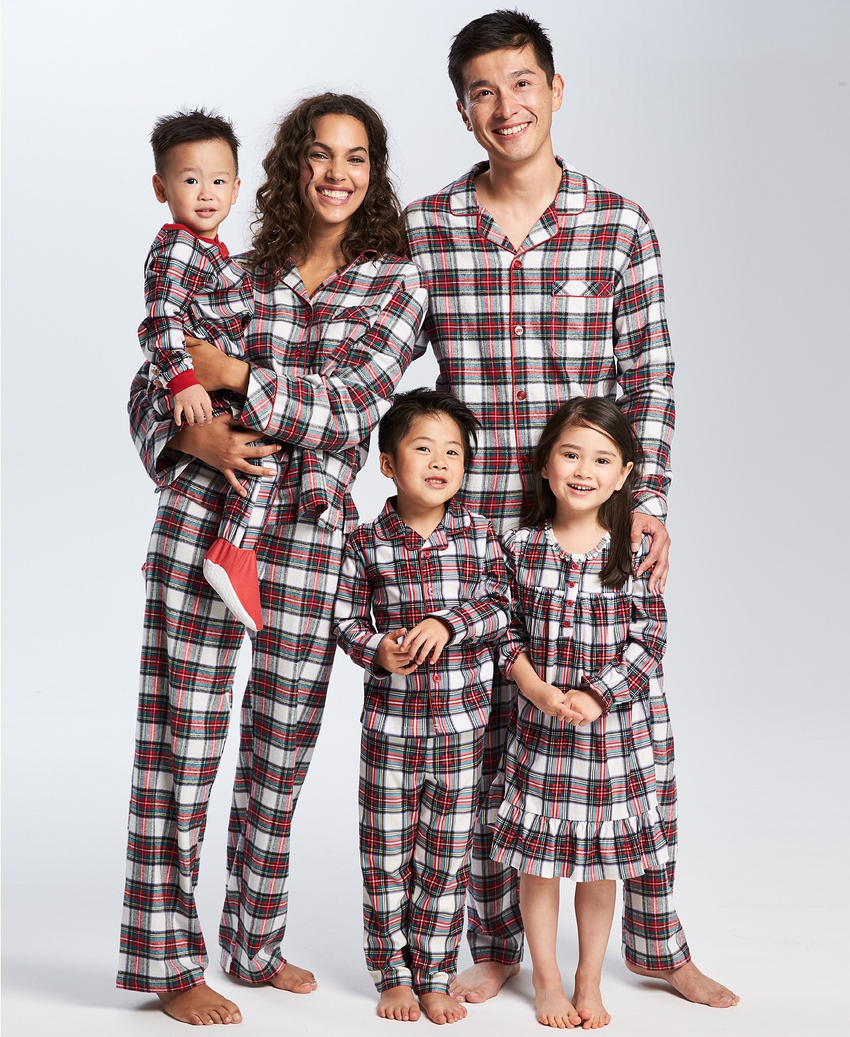 Holiday Pjs & Top Macy's Christmas Gifts featured by top Houston life and style blog, Fancy Ashley" image of a family wearing plaid holiday pjs available at Macy's