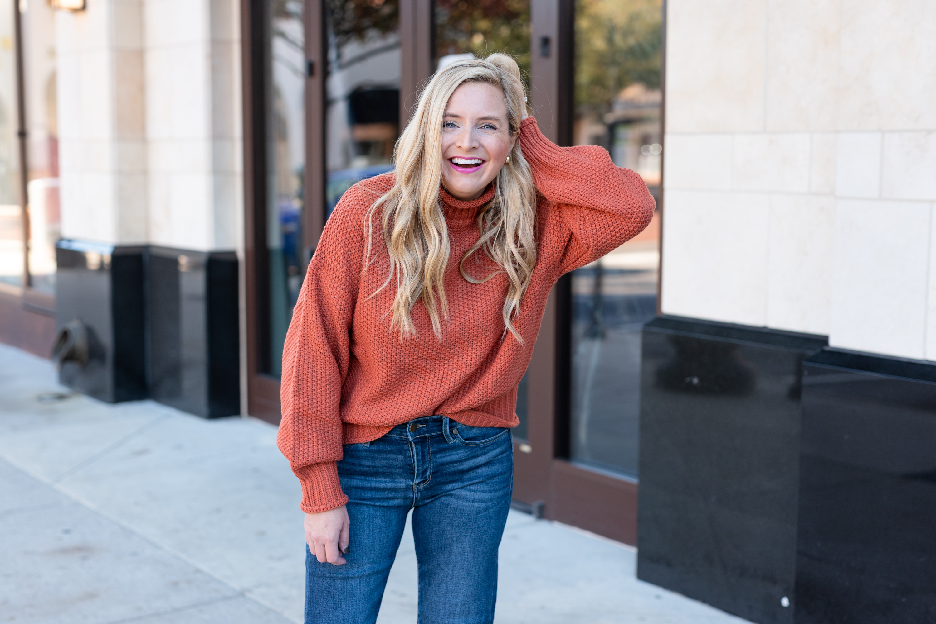 Amazon Prime Day by popular Houston life and style blog, The House of Fancy: image of a woman wearing a Free People mock neck sweater with jeans. 