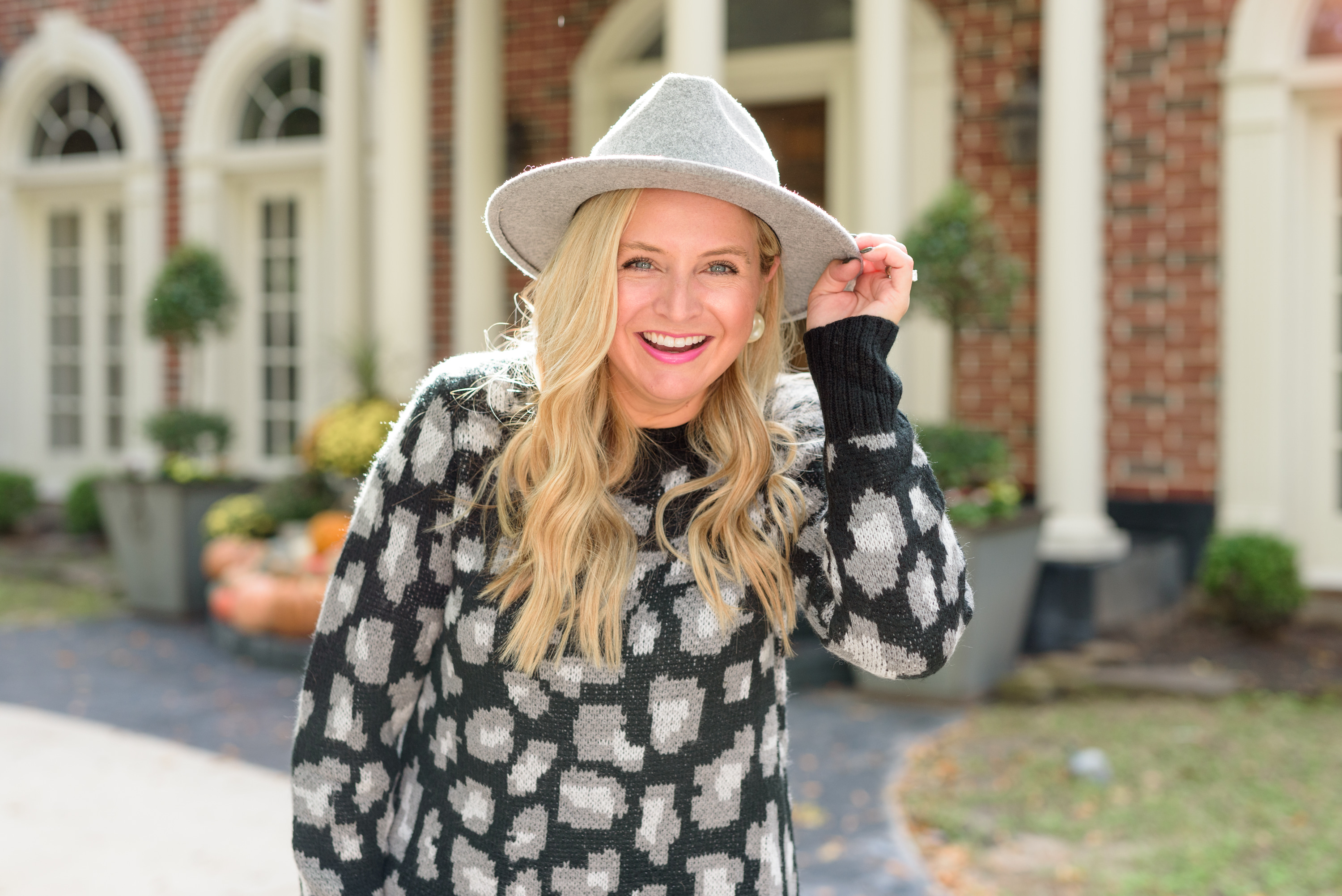 Fall Clothing by popular Houston fashion blog, Fancy Ashley: image of a woman wearing a Walmart Scoop Women's Leopard Print Sweater Dress, Walmart Scoop Alexandra Women’s Over the Knee Heeled Boots, and Walmart Time and Tru Women's Chenille Fedora with Braided Trim.