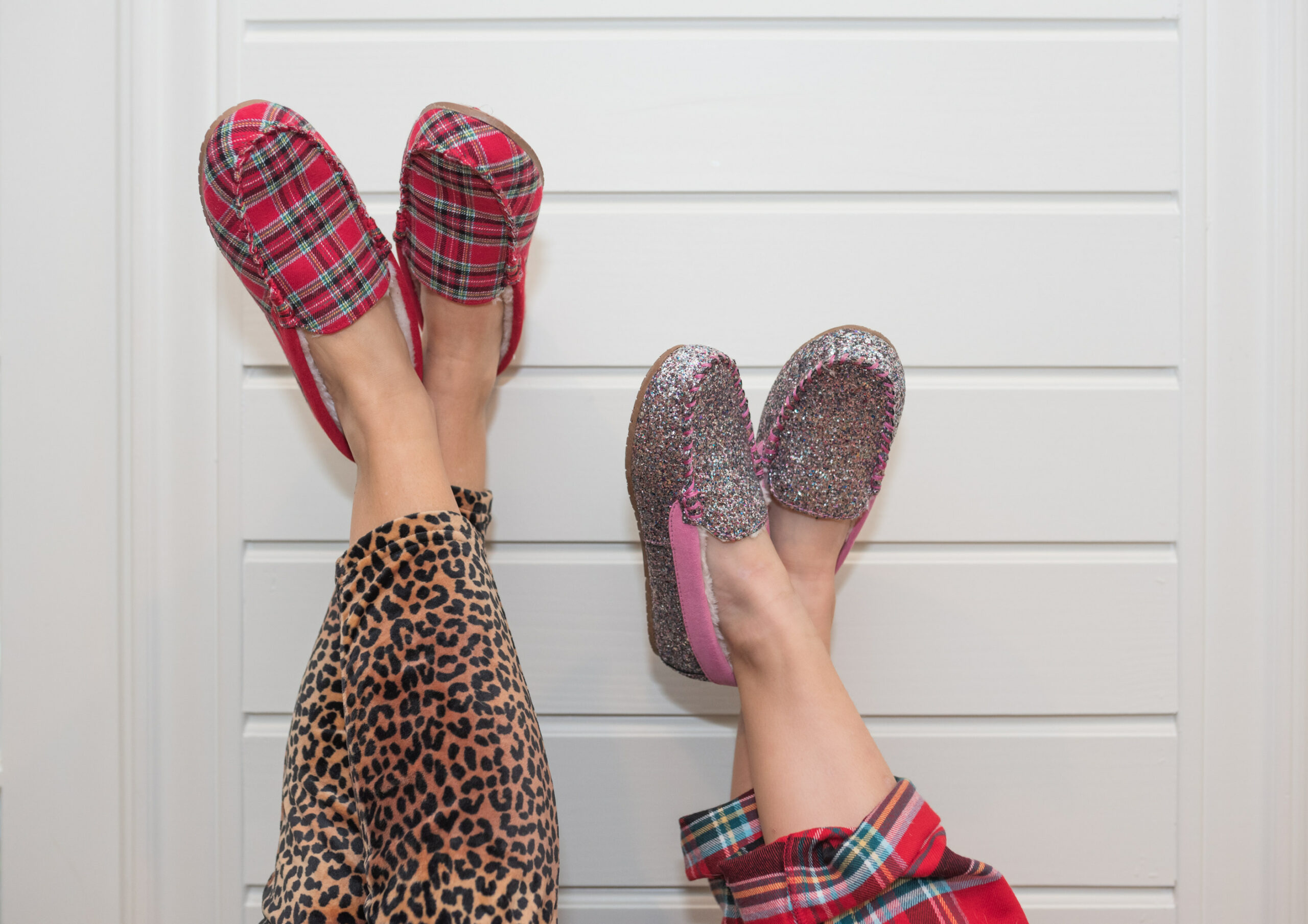 Family Christmas Pajamas by popular Houston fashion blog, Fancy Ashley: image of a mom and daughter wearing red plaid and glitter moccasin slippers from Land's End. 