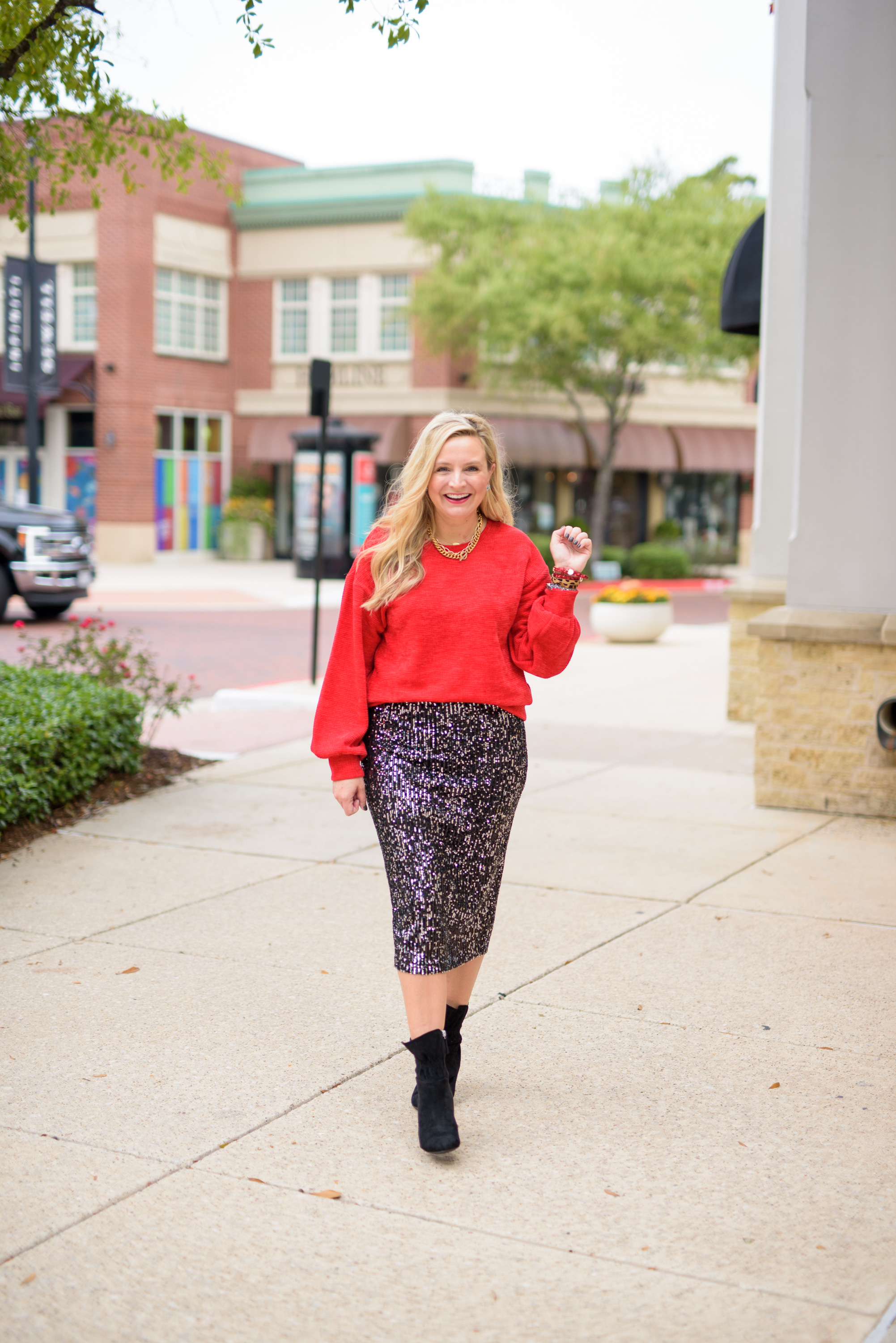 Walmart Womens Clothes by popular Houston fashion blog, Fancy Ashley: image of a woman wearing a Walmart Time and Tru Women's Chenille Sweater Walmart Scoop Sequin skirt, and Walmart Scoop black suede booties.