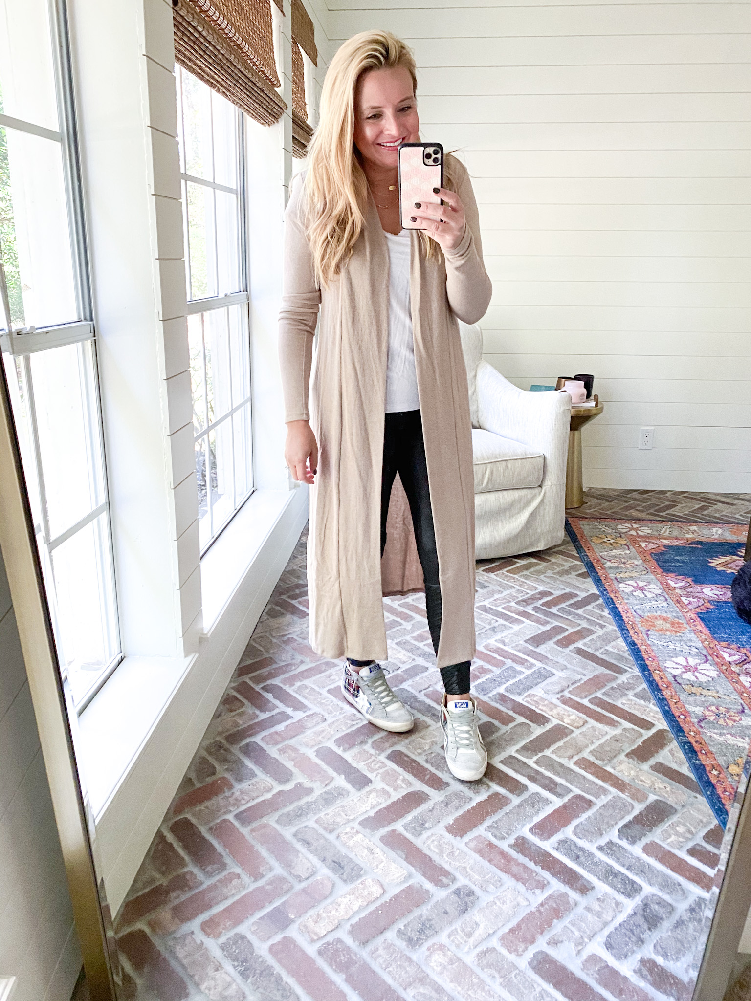 Gibson Look by popular Houston fashion blog, Fancy Ashley: image of a woman wearing a Gibson Look duster, Gibson Look t-shirt, Gibson Look Skye Cozy Fleece Jogger and Golden Goose sneakers. 