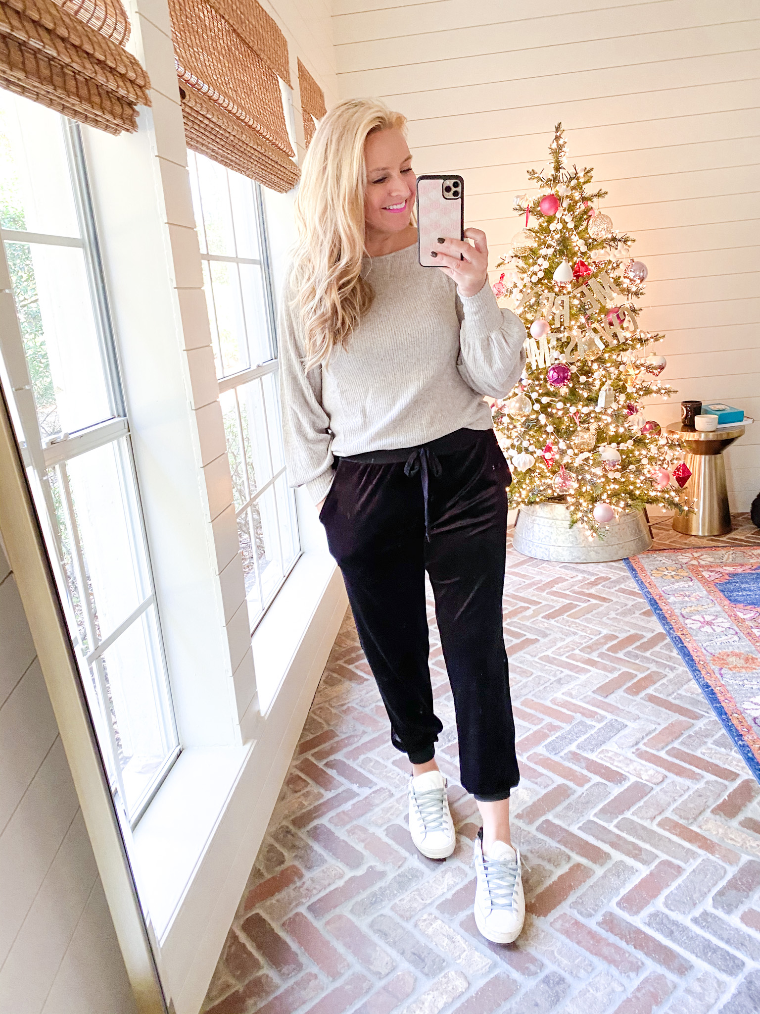 November Outfits by popular Houston fashion blog, Fancy Ashley: image of a woman wearing a grey sweater, black velvet joggers, and white sneakers. 