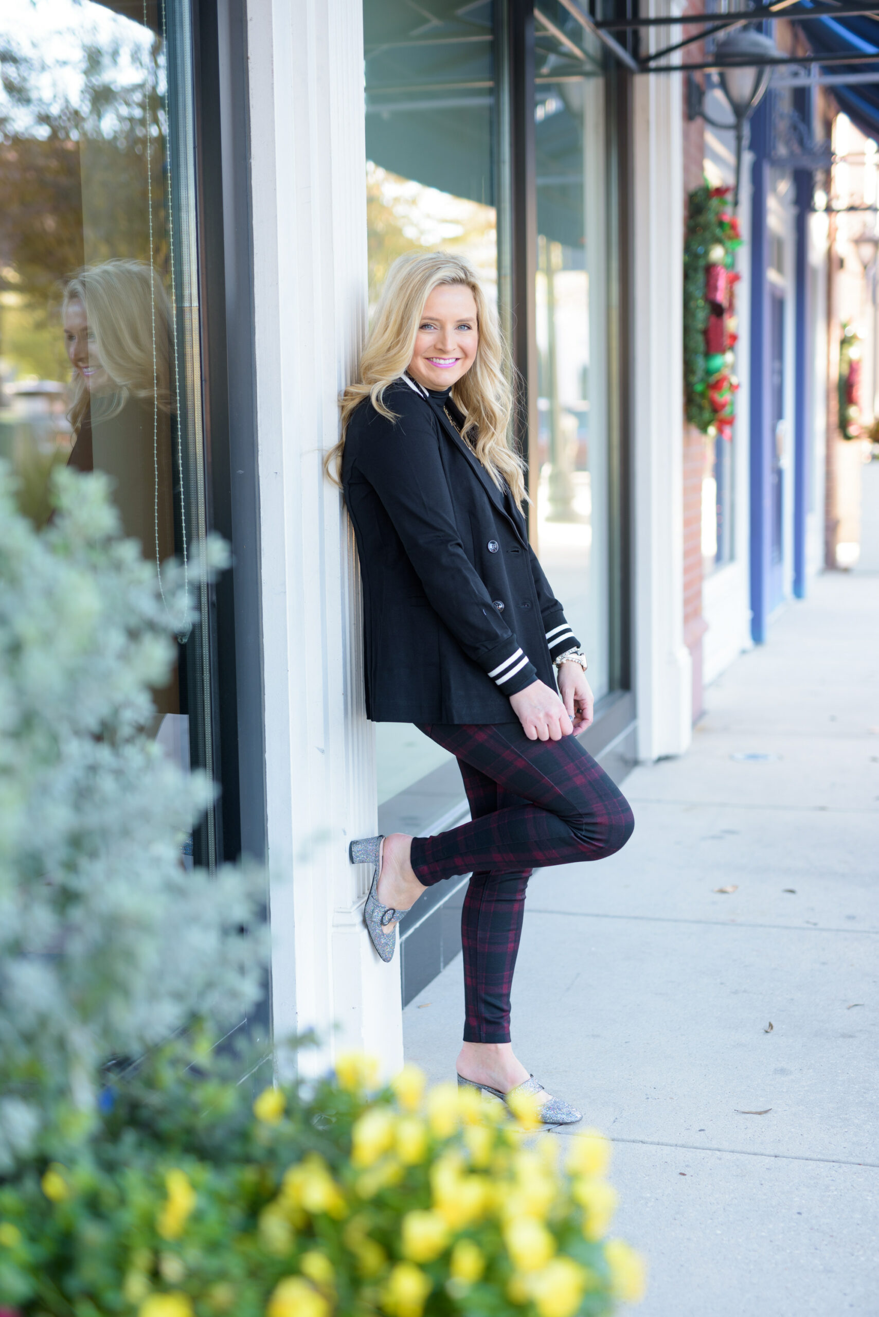 Winter Outfits by popular Houston fashion blog, Fancy Ashley: image of a woman standing outside and wearing Liverpool Los Angeles plaid pants, black turtleneck top, and black blazer. 
