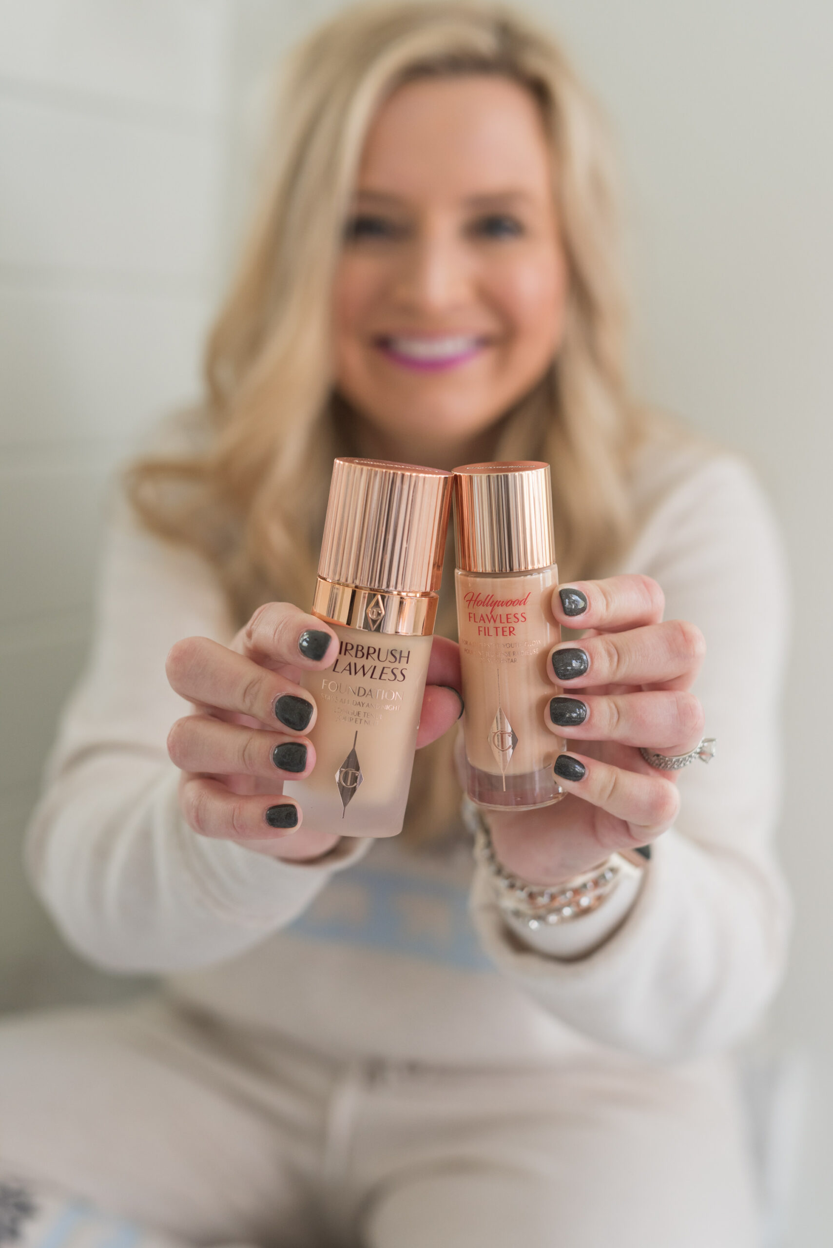 Nordstrom Beauty by popular Houston beauty blog, Fancy Ashley: image of a woman holding Clinique foundation. 