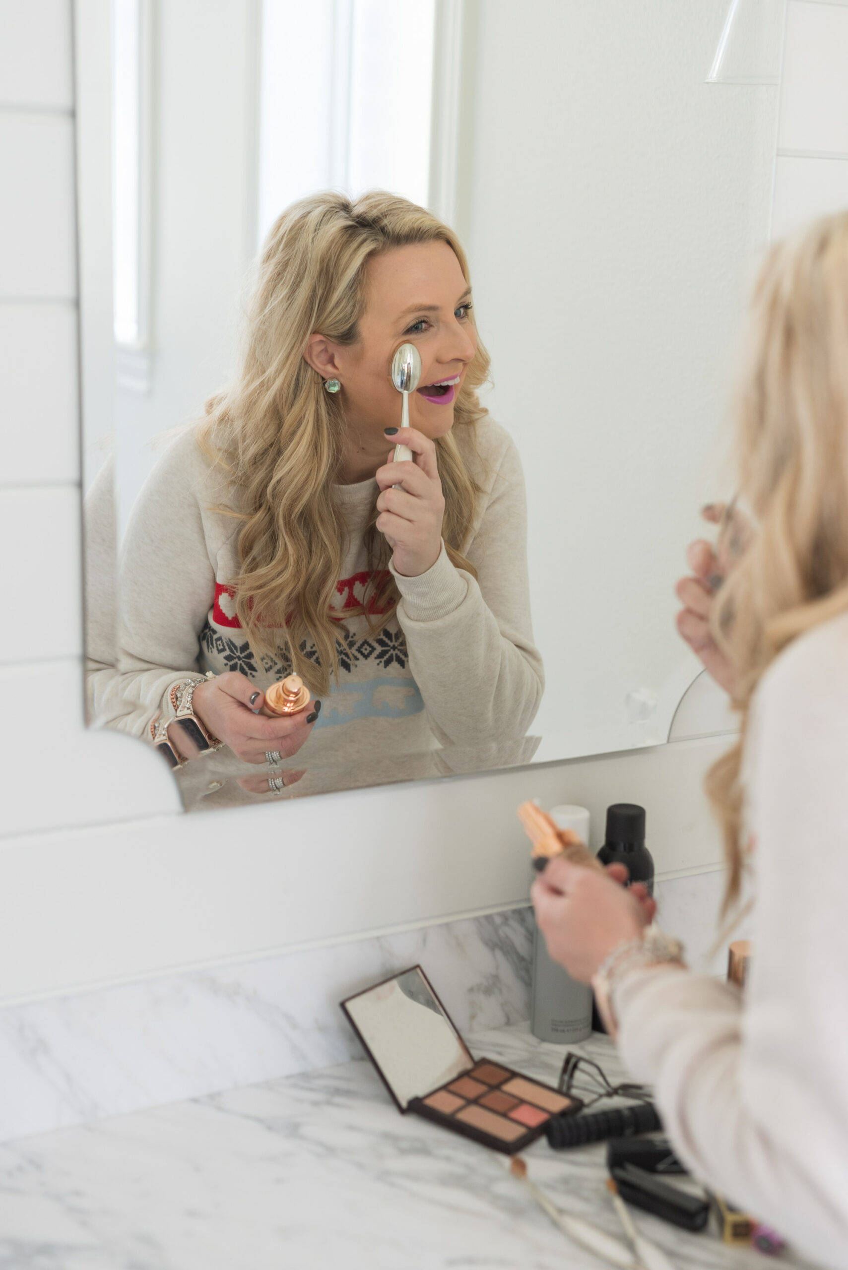 Nordstrom Beauty by popular Houston beauty blog, Fancy Ashley: image of a woman applying Clinique foundation to her face with a foundation brush. 
