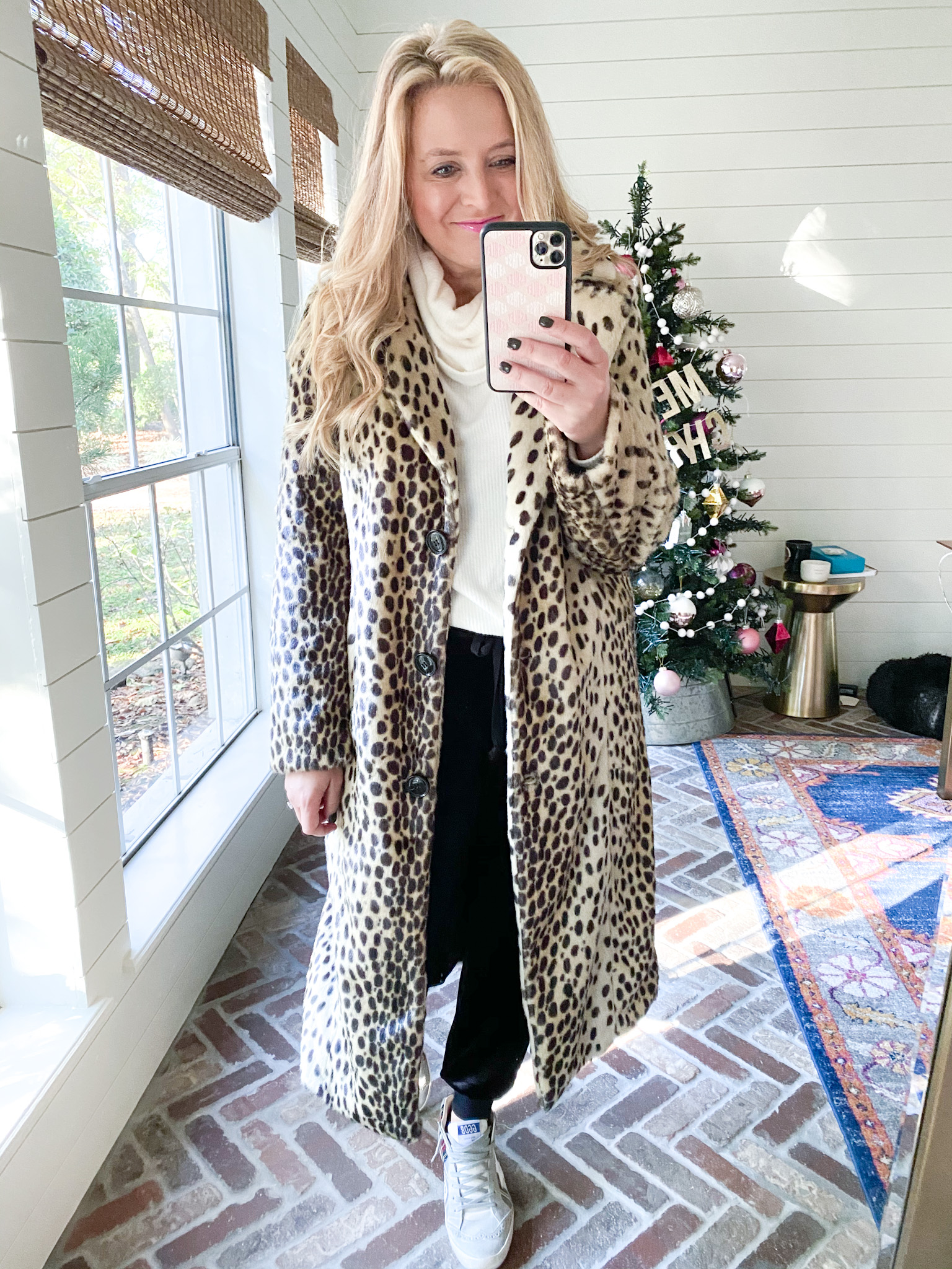 Walmart Fashion by popular Houston fashion blog, Fancy Ashley: image of a woman wearing a leopard print jacket, cream turtle neck shirt, and black pants. 