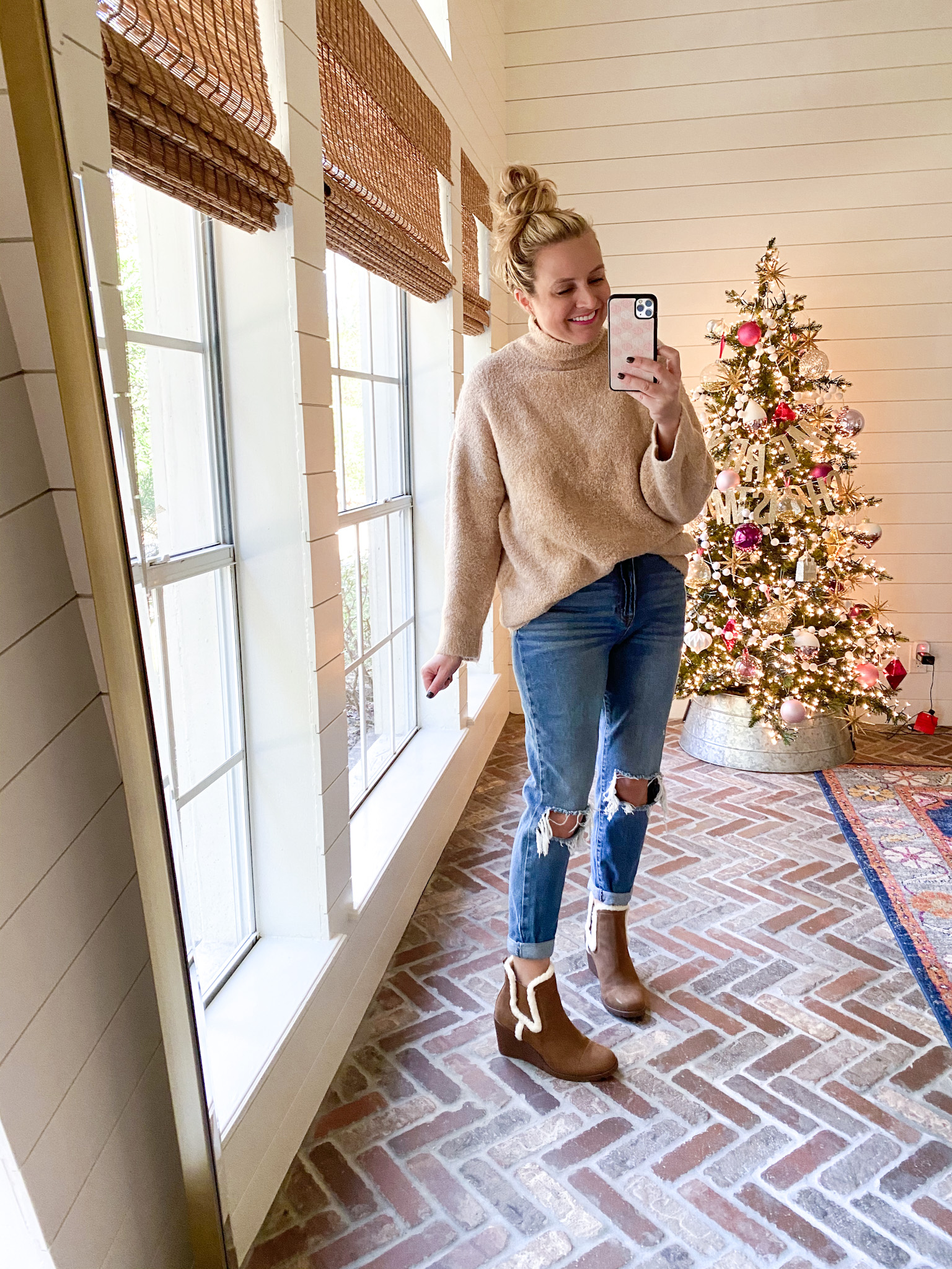 Walmart Fashion by popular Houston fashion blog, Fancy Ashley: image of a woman wearing a brown turtle neck sweater, jeans, and fur lined brown ankle boots. 