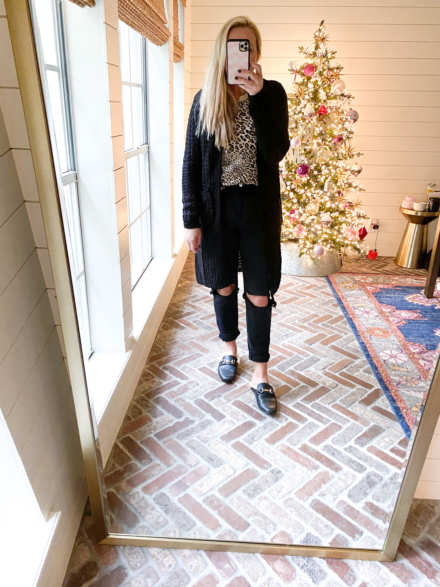 Walmart Fashion by popular Houston fashion blog, Fancy Ashley: image of a woman wearing a black duster cardigan, leopard shirt, fur line black slides, black distressed denim and black shirt.