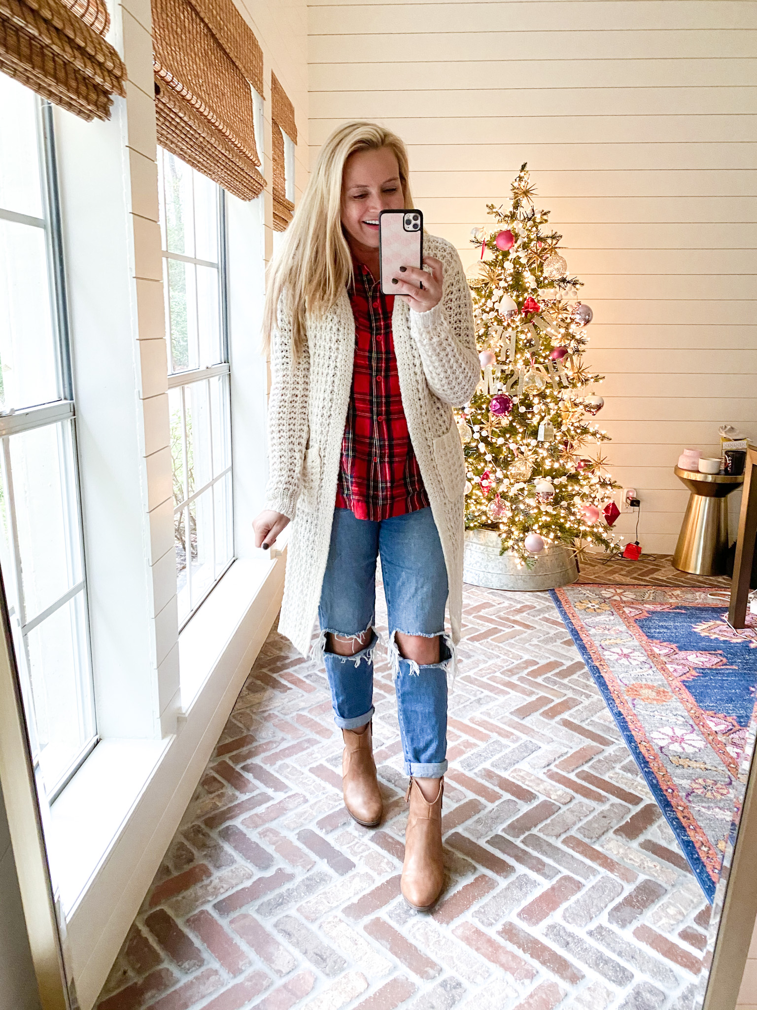 Walmart Fashion by popular Houston fashion blog, Fancy Ashley: image of a woman wearing a cream duster sweater, red plaid shirt distressed denim, and tan ankle boots.  