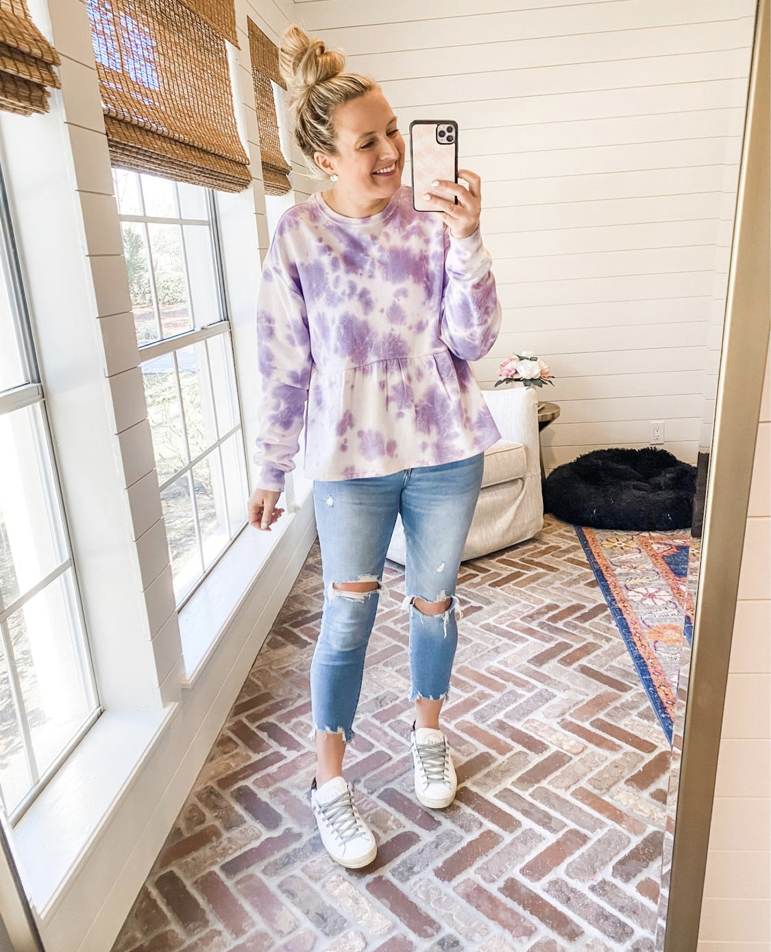 Like To Know It by popular Houston life and style blog, Fancy Ashely: image of a woman wearing a purple tie dye peplum top, distressed denim and white sneakers. 