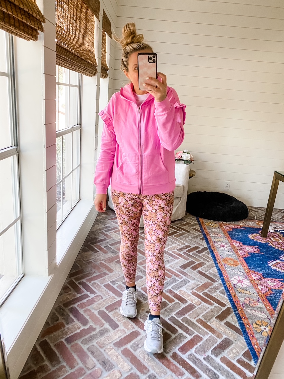 Like To Know It by popular Houston life and style blog, Fancy Ashely: image of a woman wearing a pink ruffle hoodie, pink floral print leggings, and grey sneakers. 