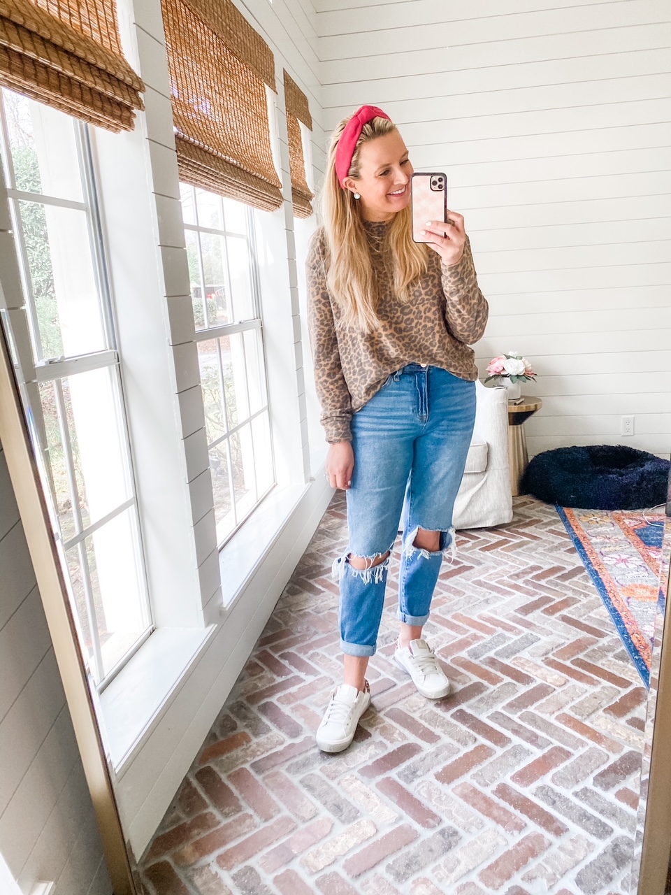 Like To Know It by popular Houston life and style blog, Fancy Ashely: image of a woman wearing a red knot headband, distressed denim, white sneakers, and long sleeve leopard print t-shirt. 