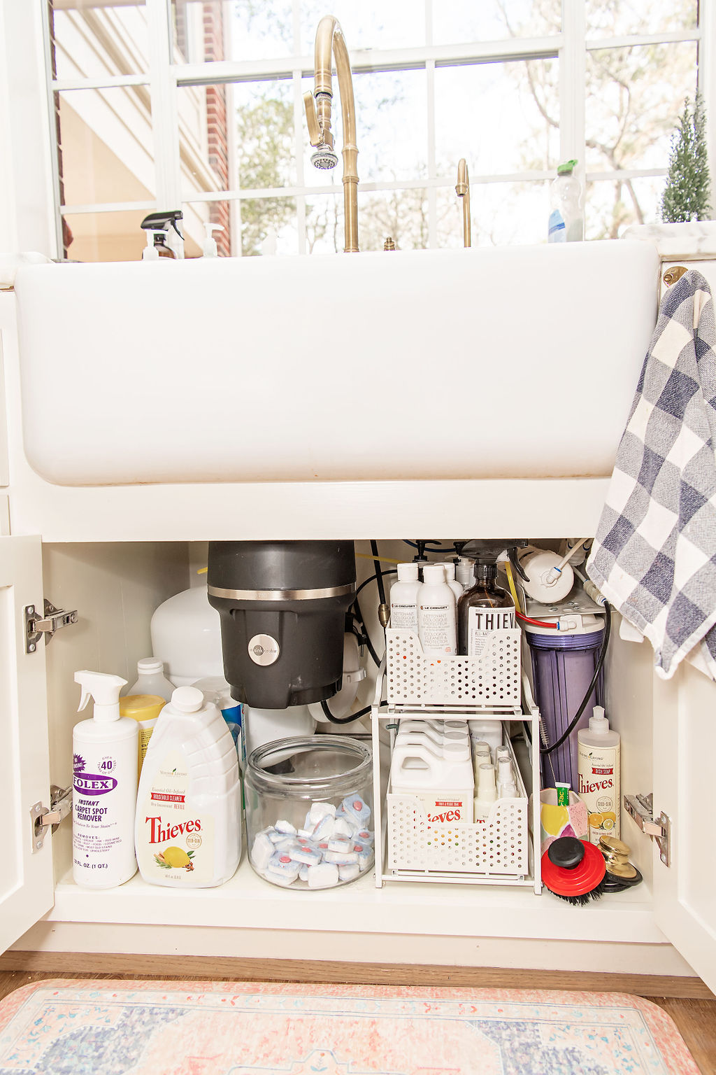 Under Bathroom Sink Organization by popular Houston lifestyle blog, Fancy Ashley: image of a bathroom under sink cabinet organize with a 3 drawer systems and a clear garbage can. 
