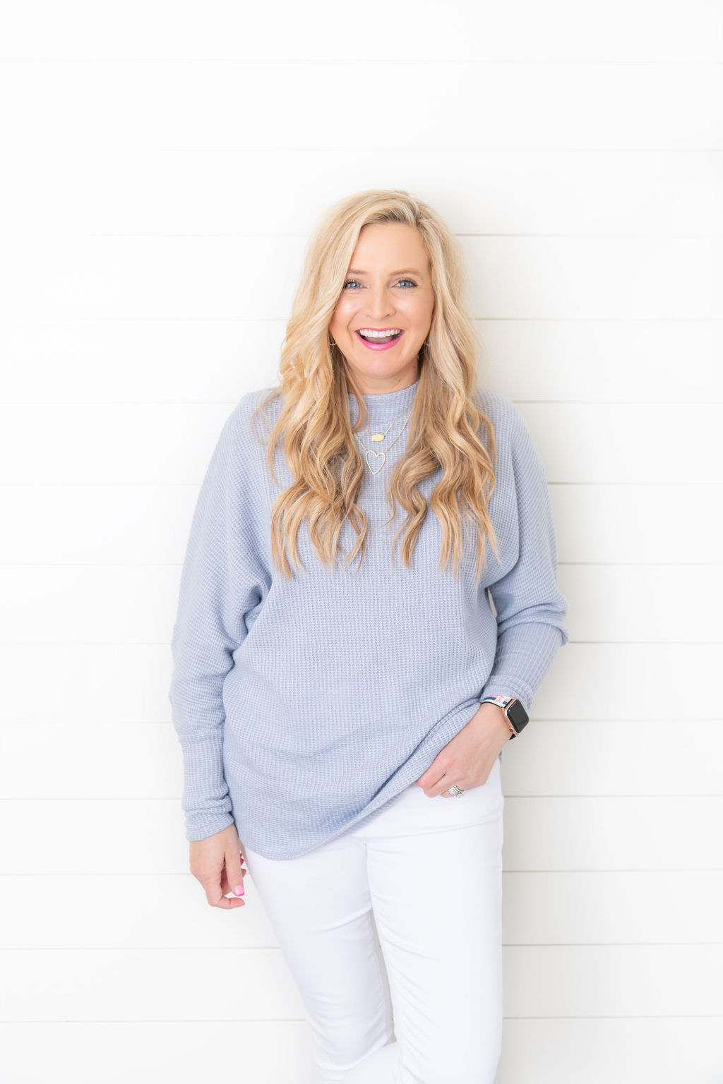 International Women's Day with Gibson by popular Houston fashion blog, Fancy Ashley: image of a woman wearing a Fancy Ashley sweater with a pair of white jeans. 