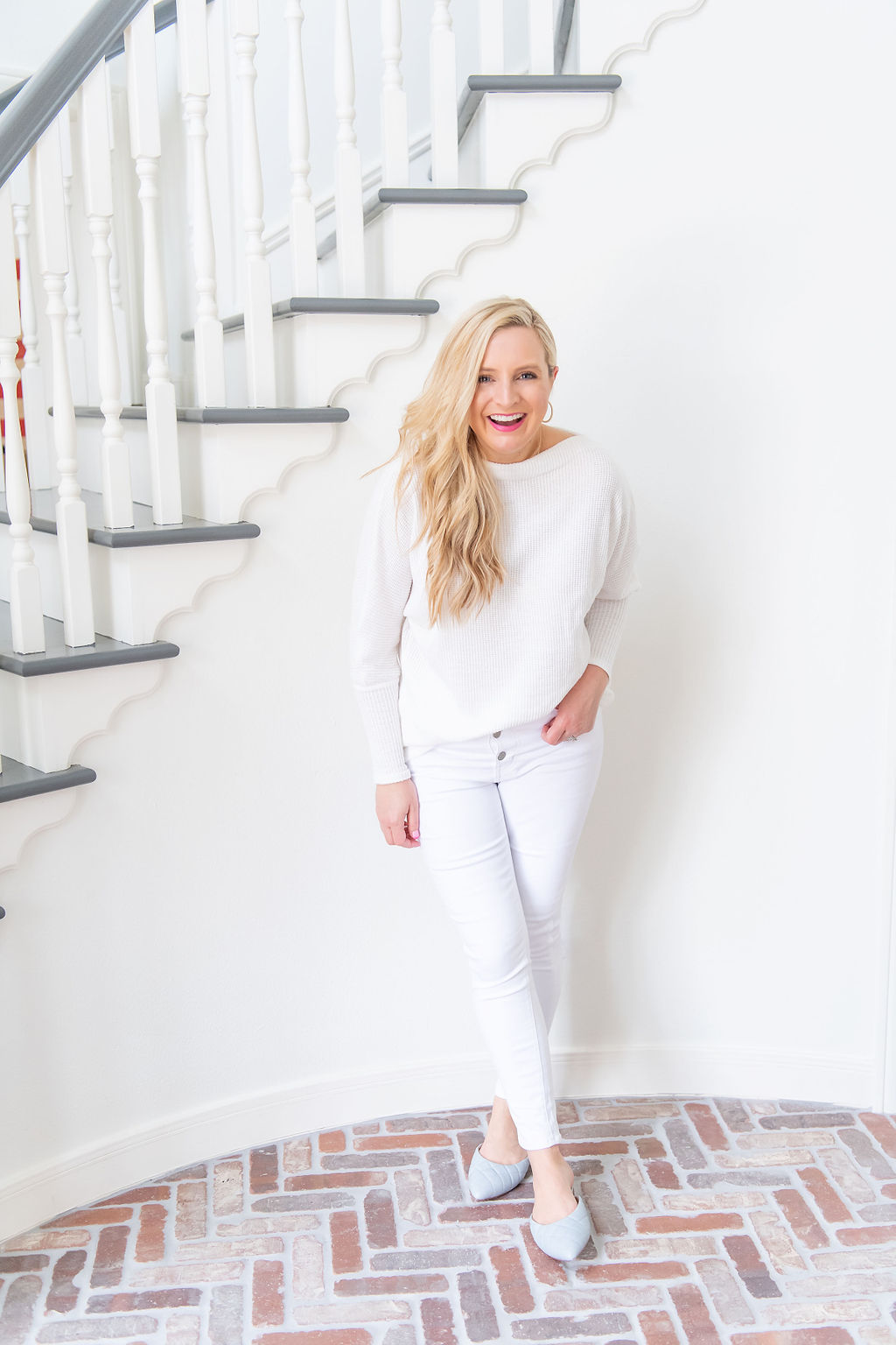 International Women's Day with Gibson by popular Houston fashion blog, Fancy Ashley: image of a woman wearing a Gibson Fancy Ashley sweater with a pair of white jeans. 