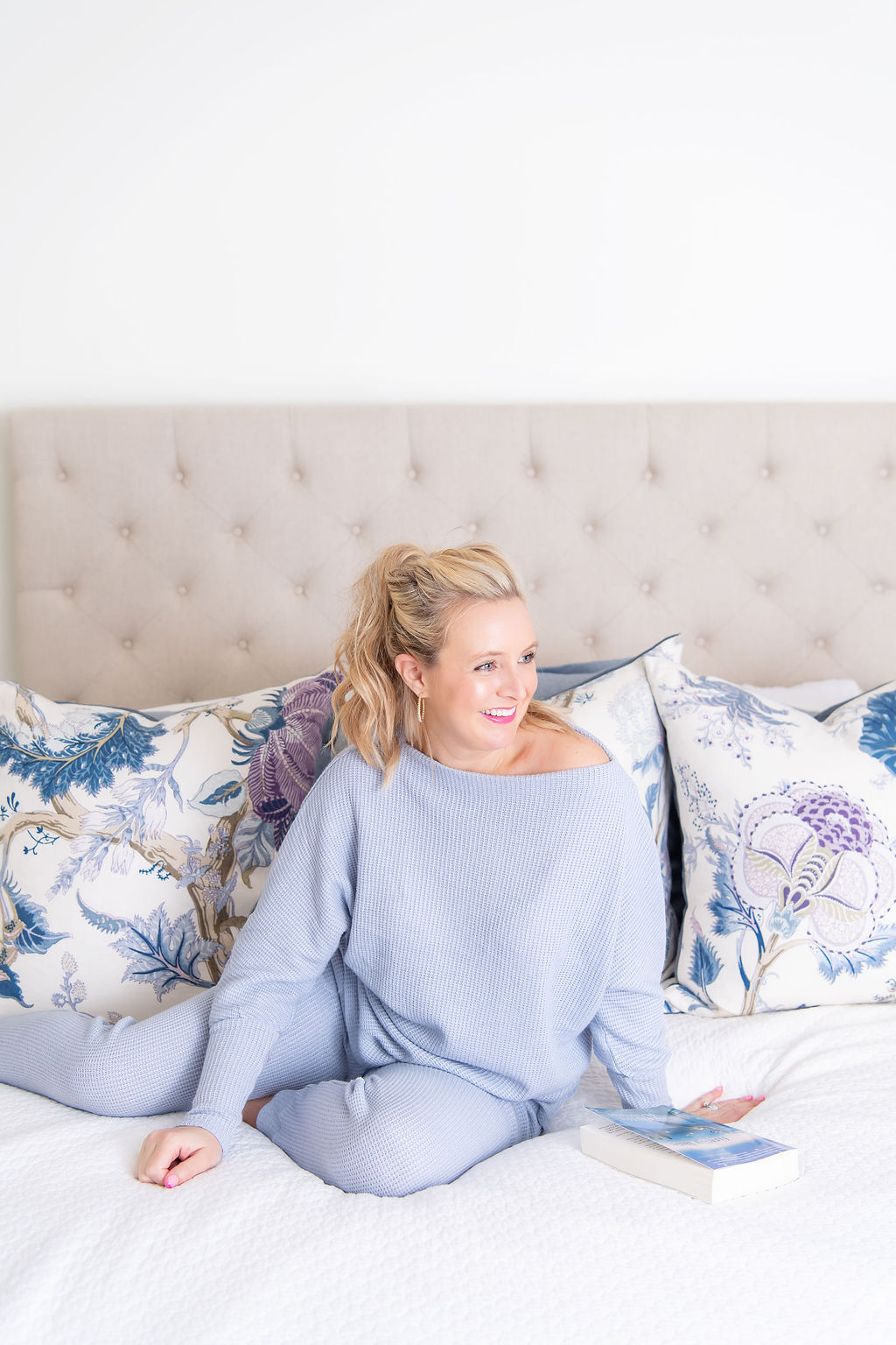 International Women's Day with Gibson by popular Houston fashion blog, Fancy Ashley: image of a woman wearing a Gibson sweater and joggers set while sitting in her bed. 