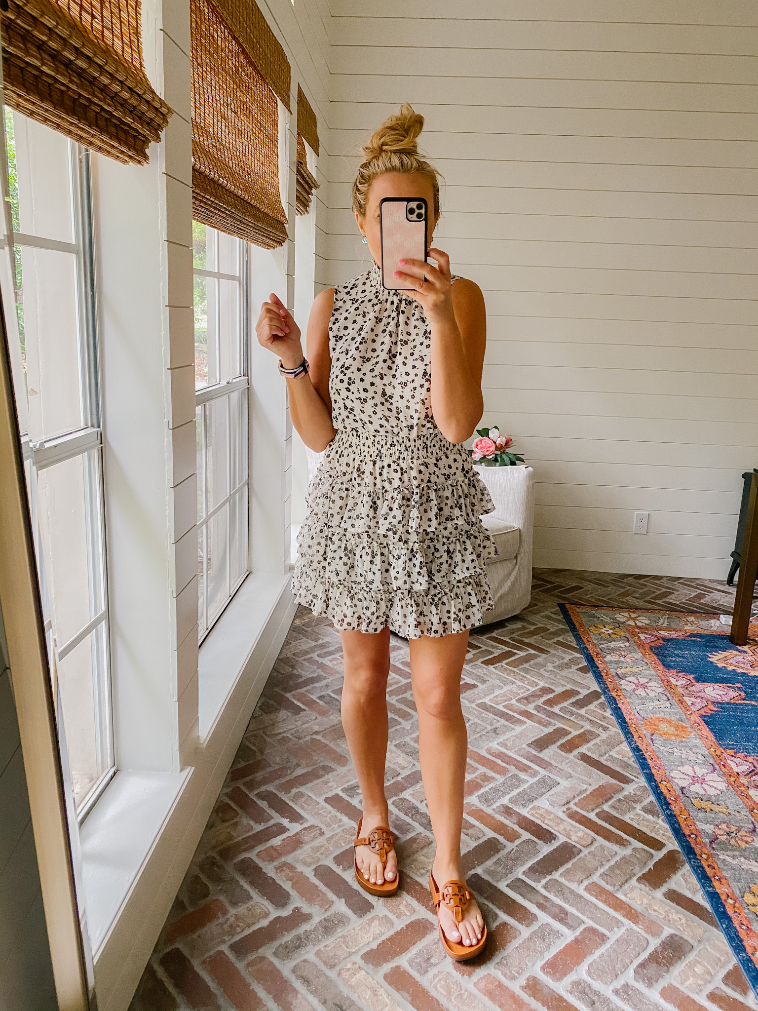 Express New Arrivals by popular Houston fashion blog, The House of Fancy: image of a woman wearing a Express sleeveless black and tan floral print ruffle tiered dress and brown slide sandals. 