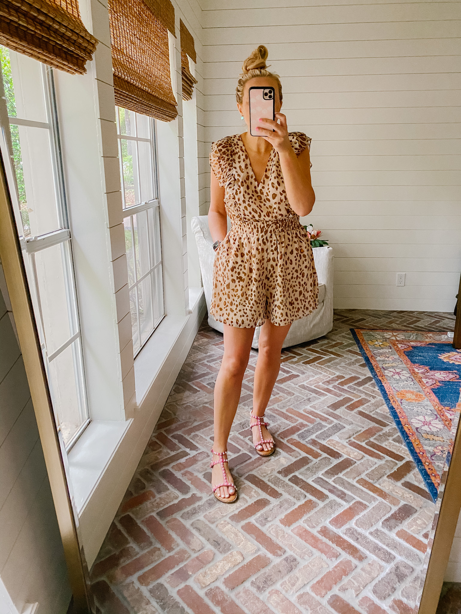 Express New Arrivals by popular Houston fashion blog, The House of Fancy: image of a woman wearing a Express leopard print romper and pink strap sandals. 