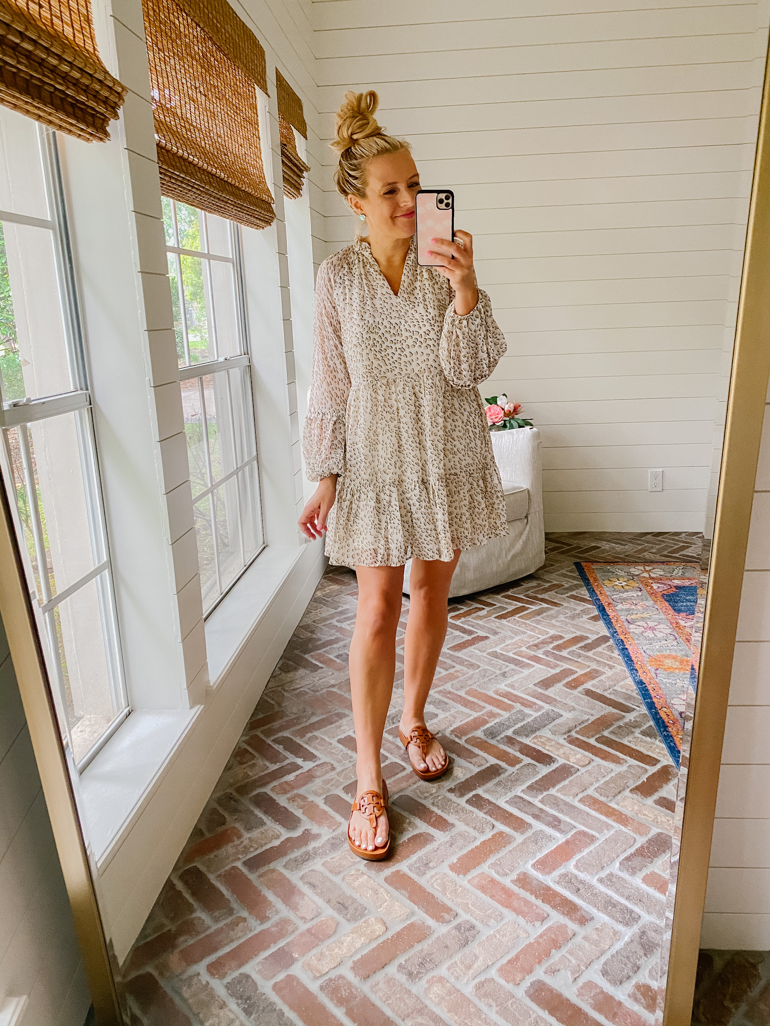 Express New Arrivals by popular Houston fashion blog, The House of Fancy: image of a woman wearing a Express leopard print dress with brown slide Tory Burch sandals. 