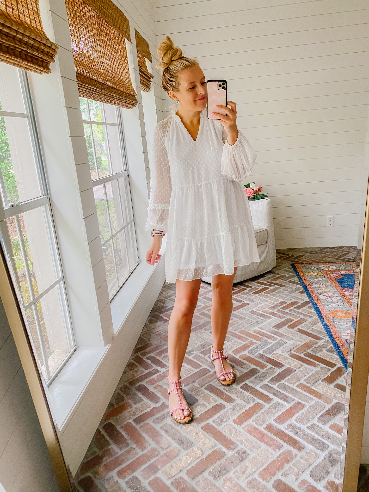 Express New Arrivals by popular Houston fashion blog, The House of Fancy: image of a woman wearing a Express white Swiss dot dress with pink strap sandals. 