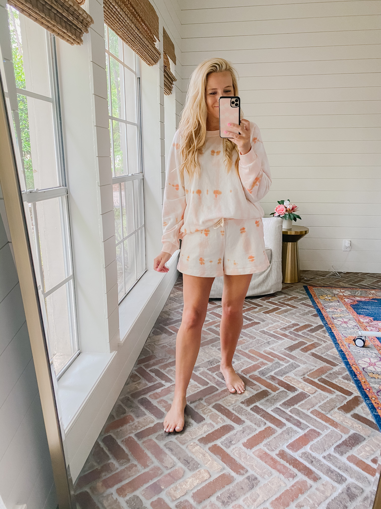 Loft Clothing by popular Houston fashion blog, The House of Fancy: image of a woman wearing a Loft orange and pink tie dye loungewear set.