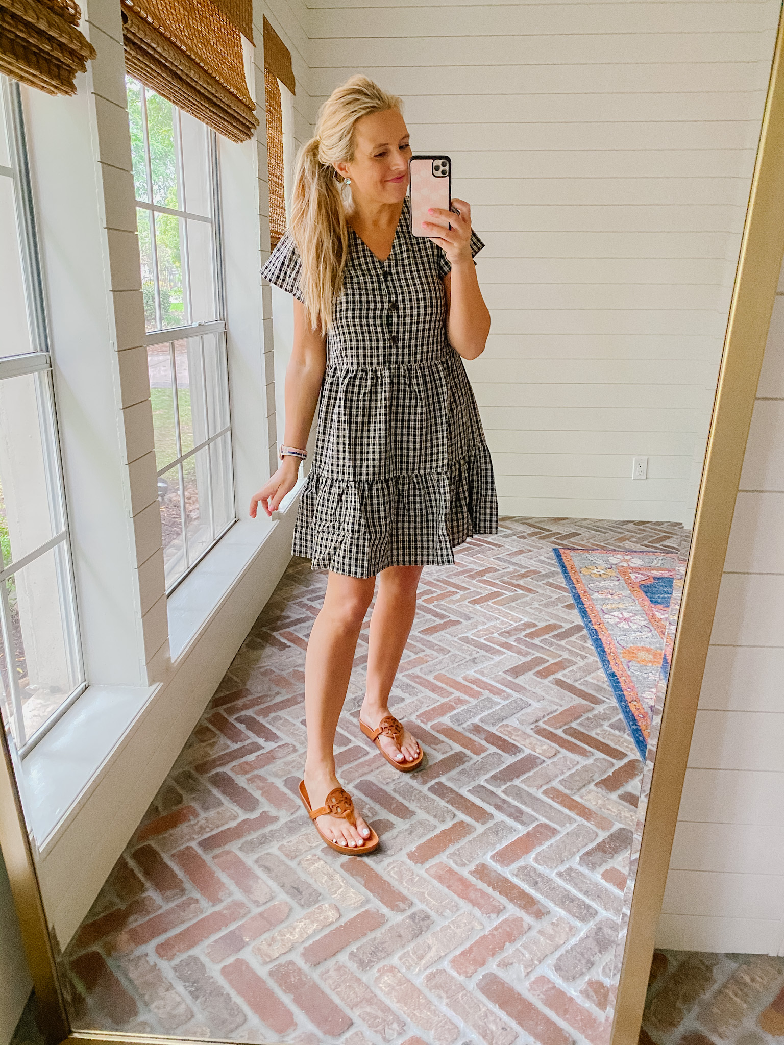 Loft Clothing by popular Houston fashion blog, The House of Fancy: image of a woman wearing a Loft black and white plaid dress with brown Tory Burch slide sandals. 