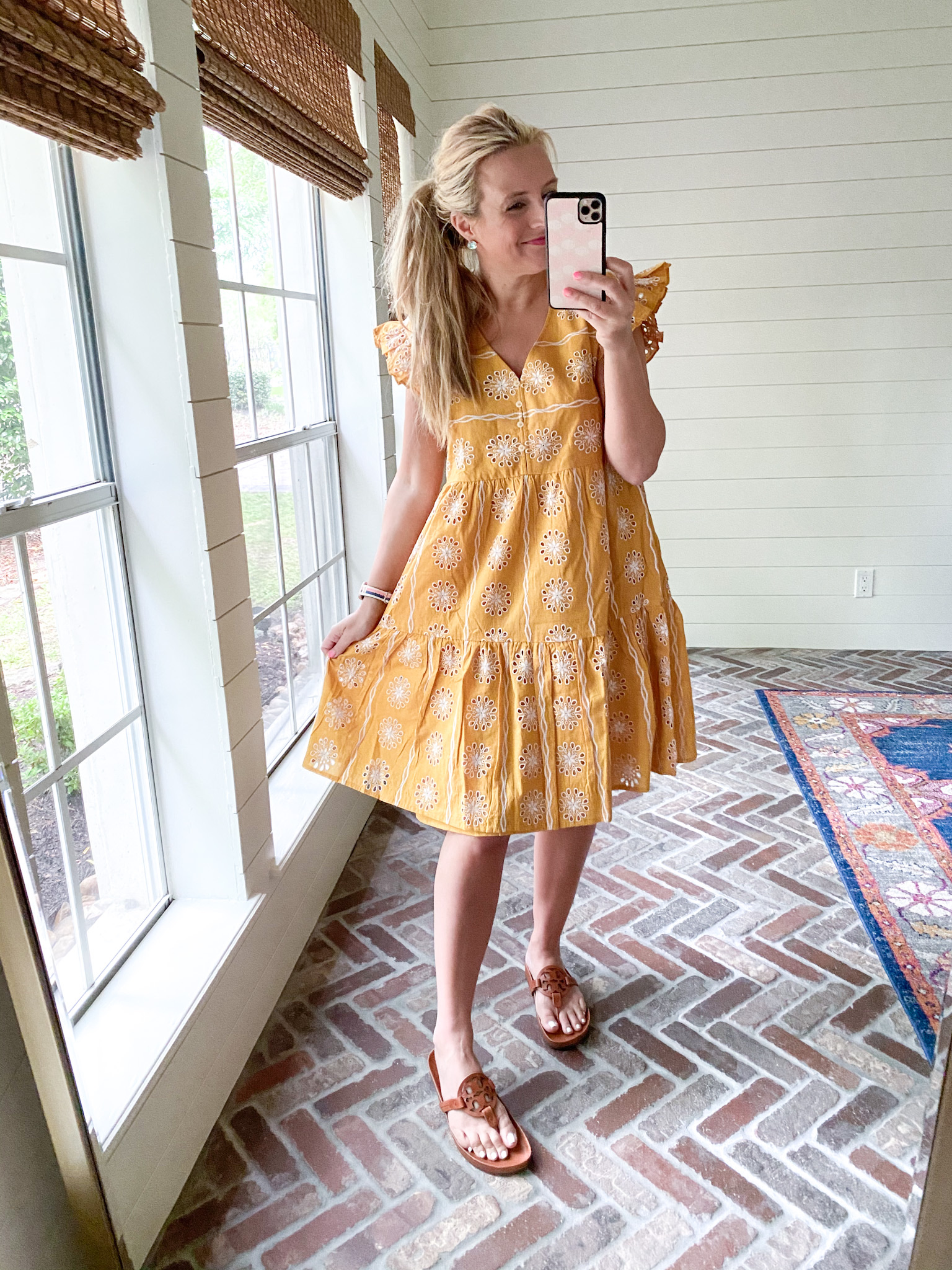 Loft Clothing by popular Houston fashion blog, The House of Fancy: image of a woman wearing a Loft yellow and white eyelet dress with brown Tory Burch slide sandals. 