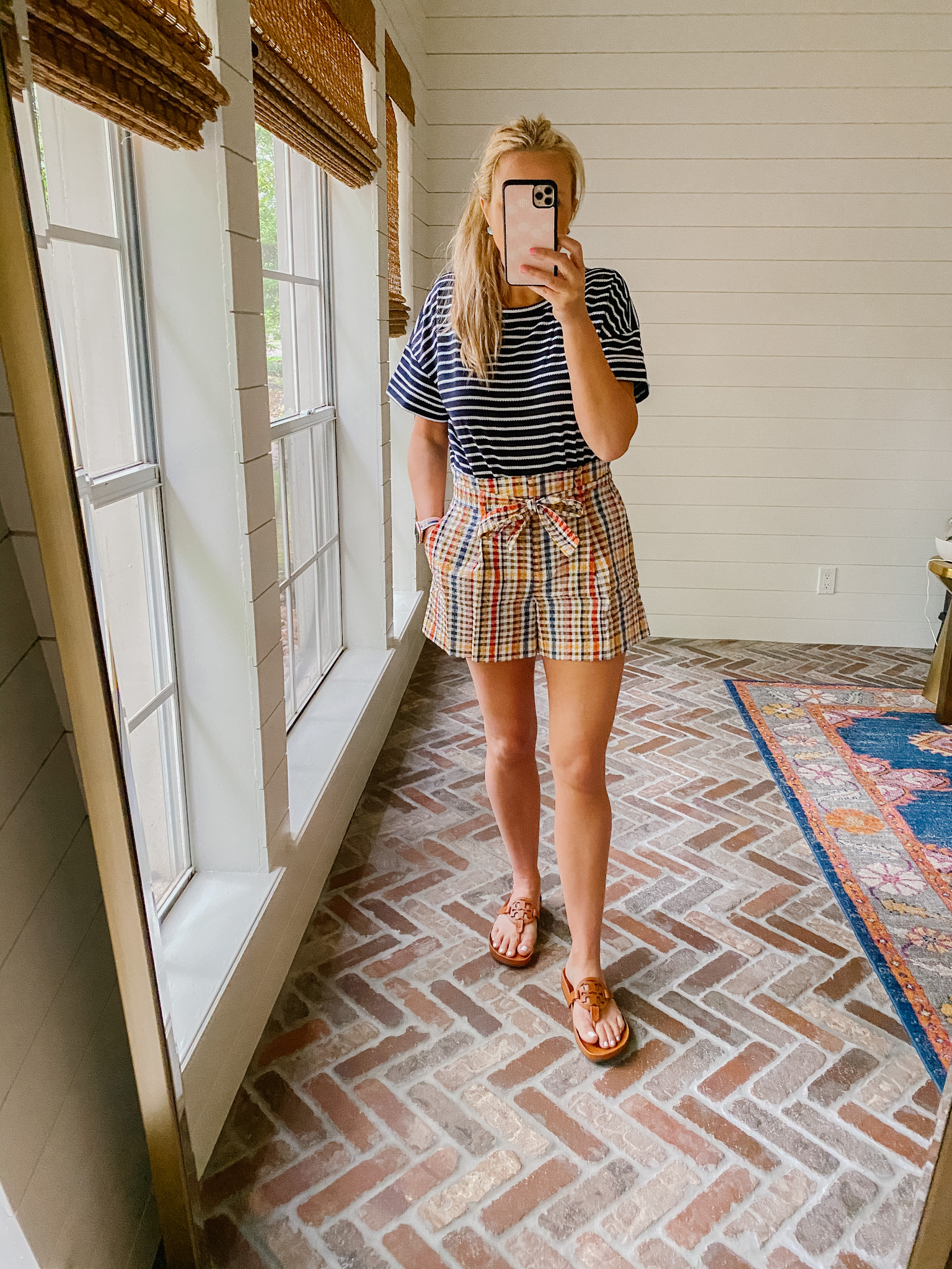 Loft Clothing by popular Houston fashion blog, The House of Fancy: image of a woman wearing a Loft blue and white stripe top, plaid paper bag shorts, and brown Tory Burch slide sandals. 