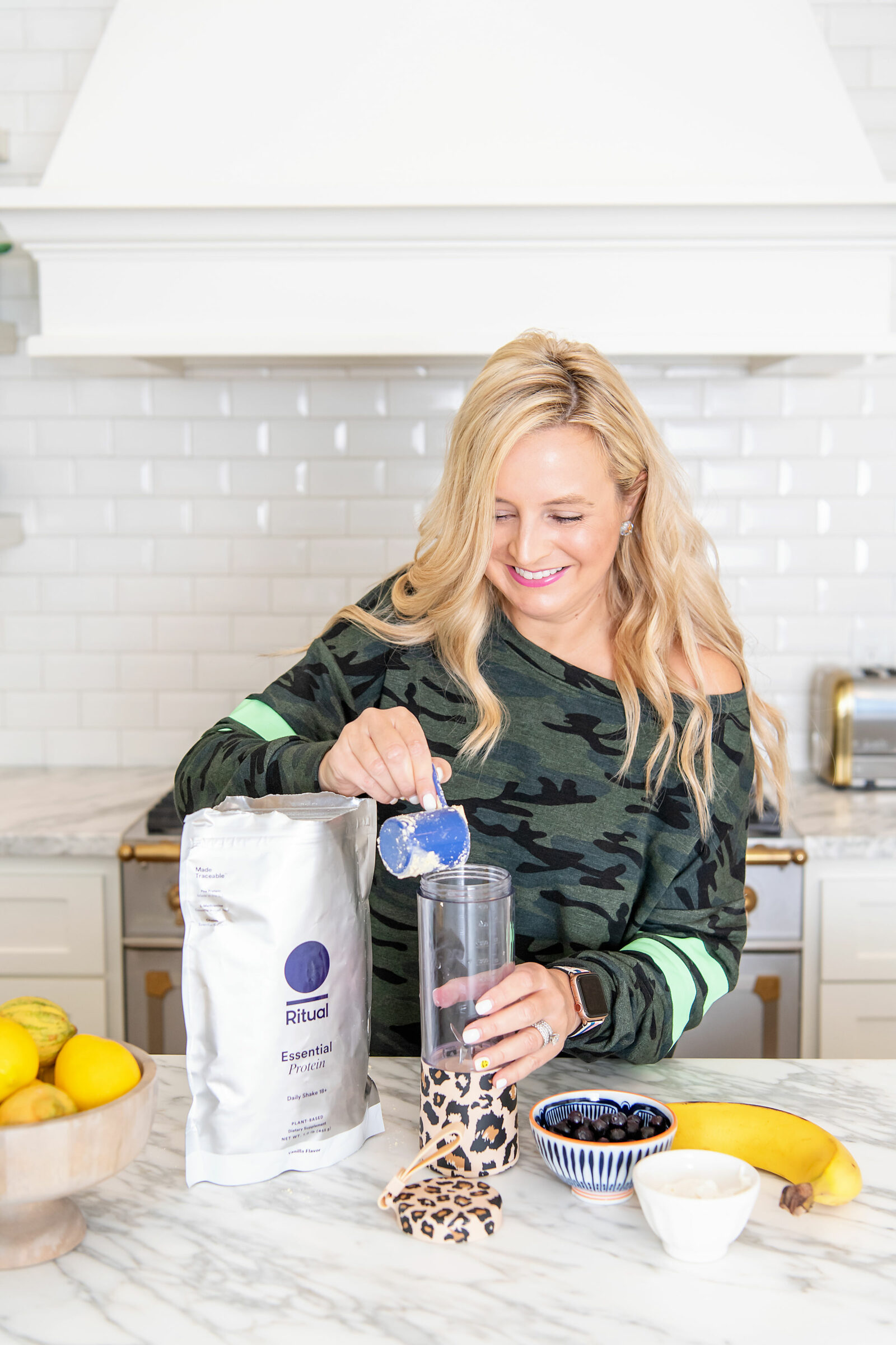 Healthy Living by popular Houston lifestyle blog, The House of Fancy: image of a woman wearing a camo top and putting ritual powder in a leopard print cup. 