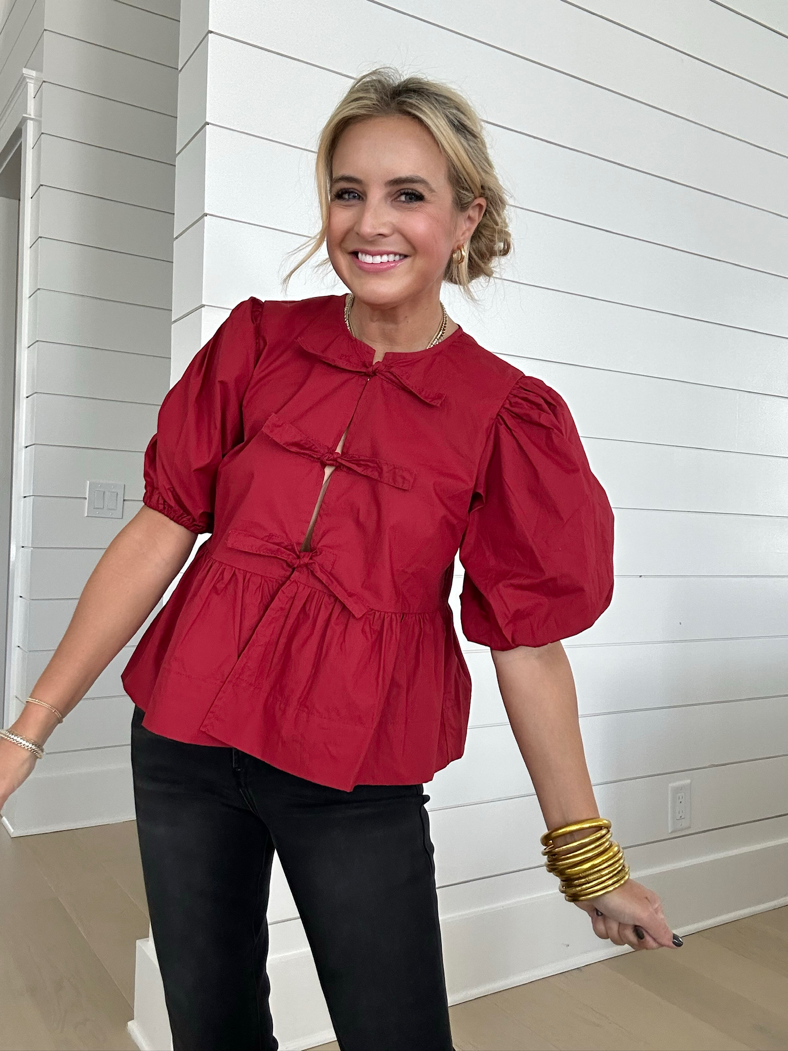 Red bow tie top and black jeans